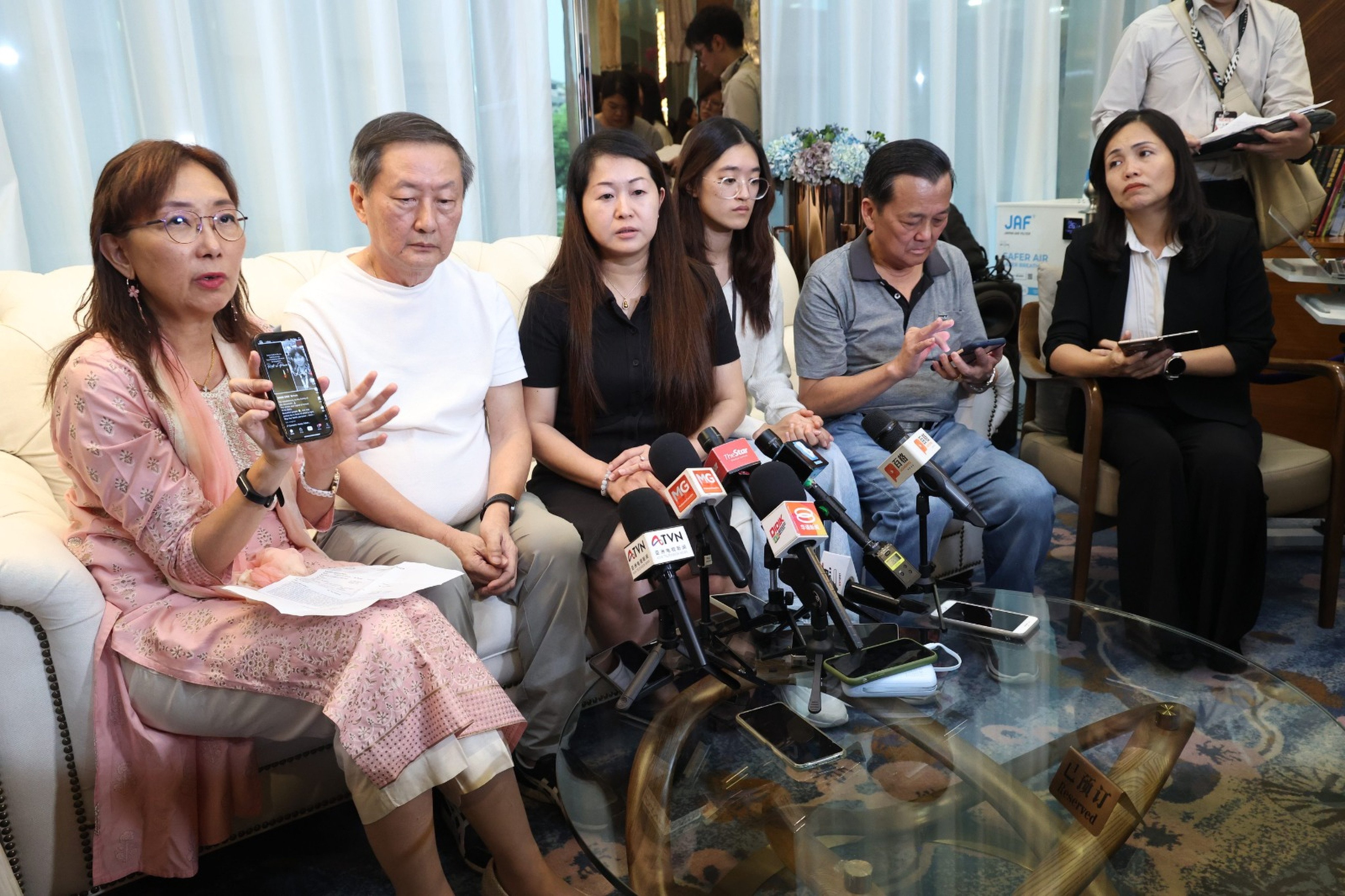 Wong Lee Ping (centre) speaks at her daughter’s wake in Kuala Lumpur on Thursday. Photo: Handout