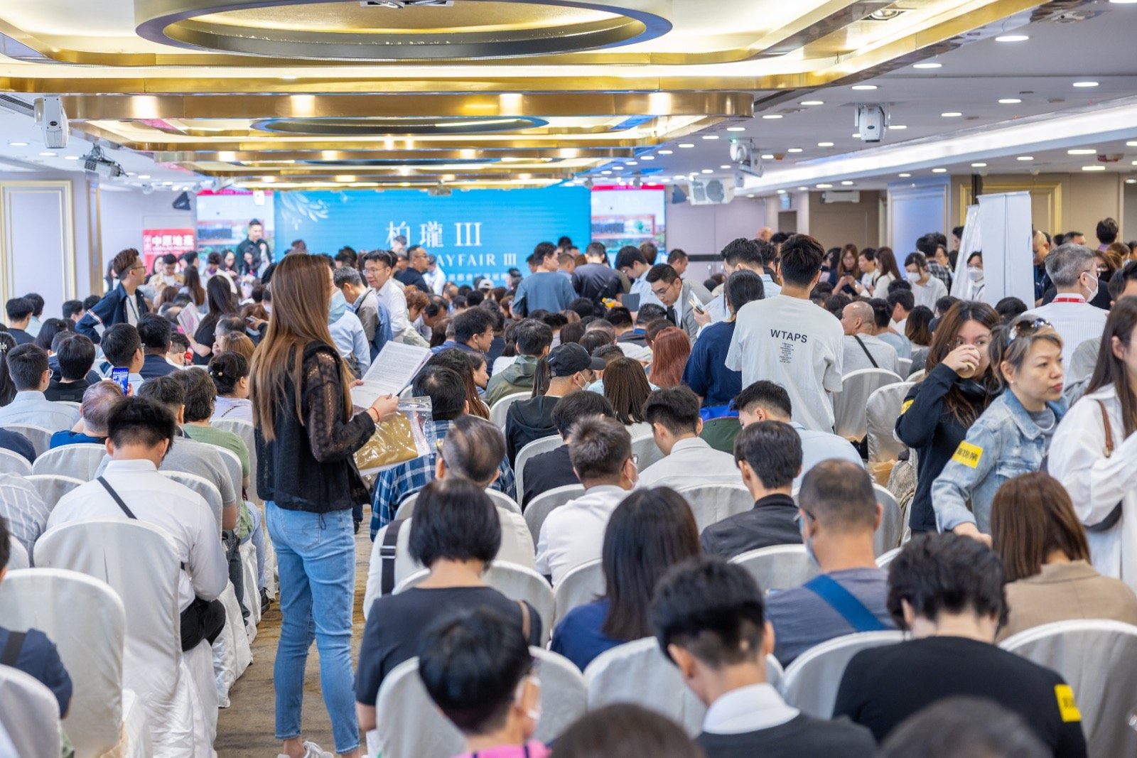 Potential buyers wait to buy flats in the Grand Mayfair III residential development in Yuen Long on Monday. Photo: Handout