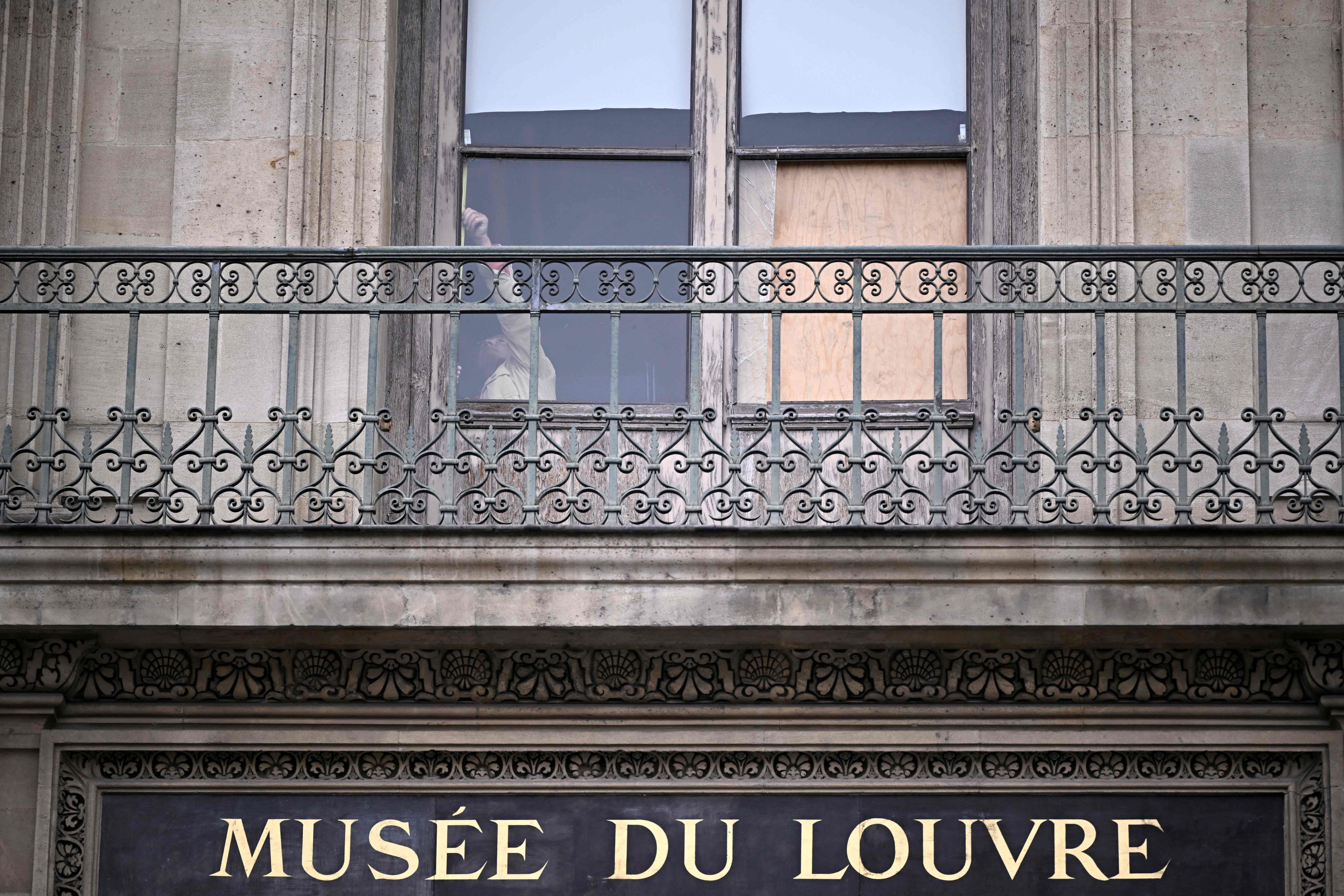 The boarded up window where thieves entered the Louvre to steal priceless royal jewellery. Photo: AFP