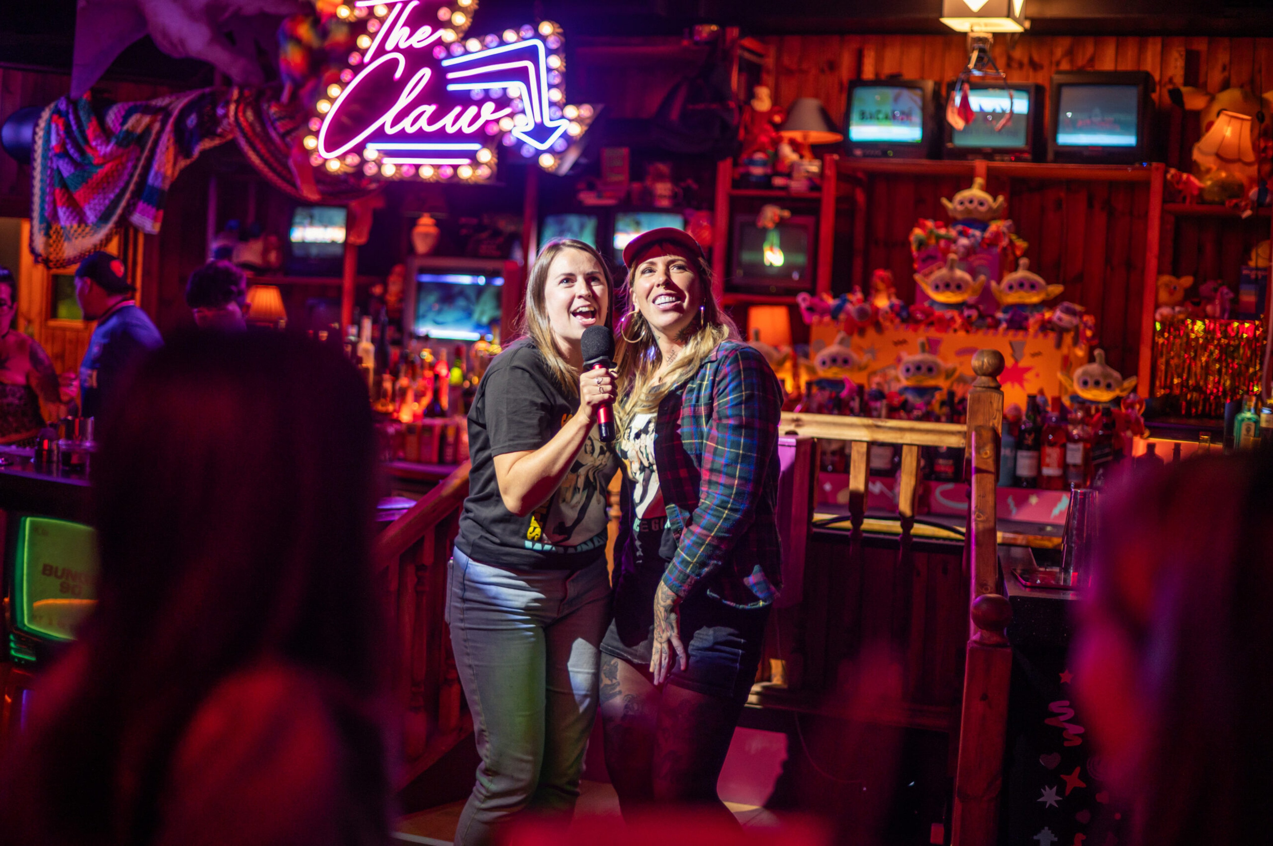 People sing karaoke at Bunga 90, a ’90s-themed bar, karaoke and pizza venue in London. The decade continues to dominate culture, and experts offer insights as to why. Photo: Bunga 90