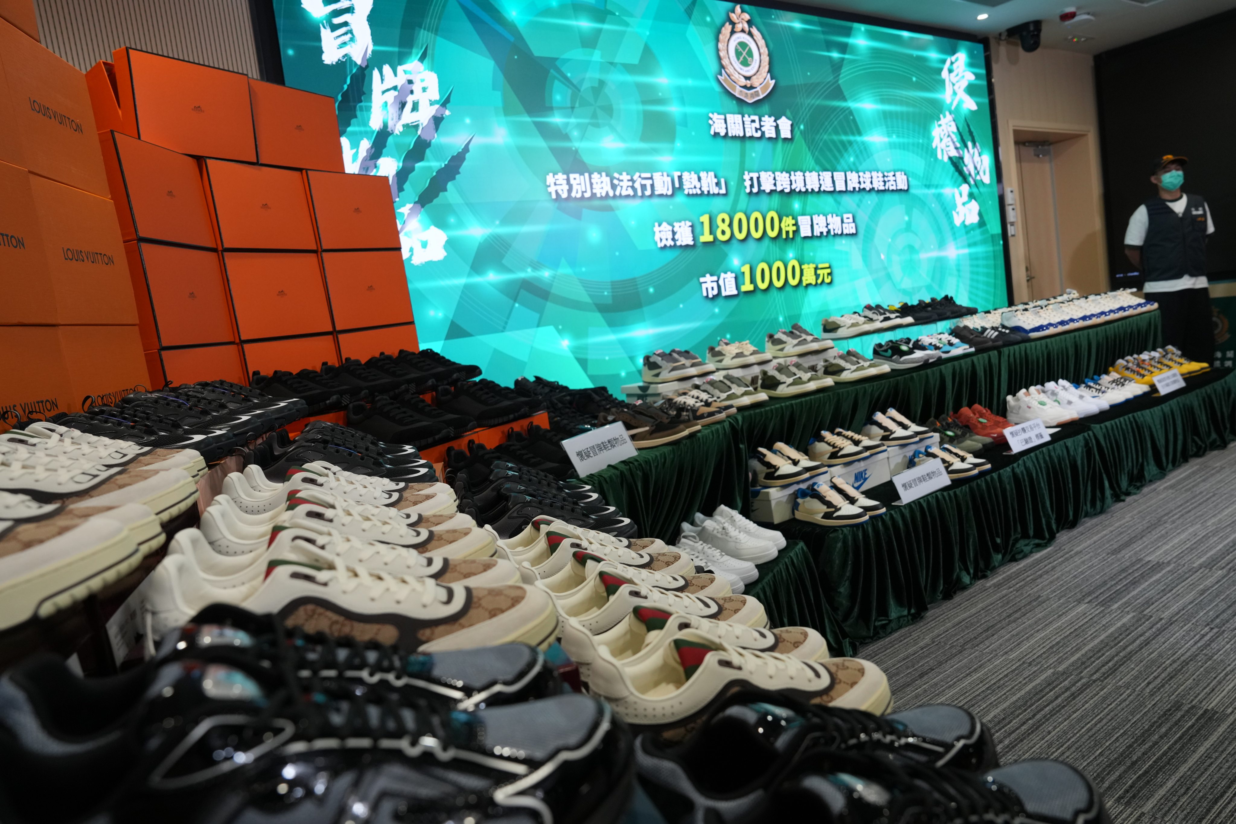 Customs showcases some of the confiscated bogus footwear. Photo: Jelly Tse