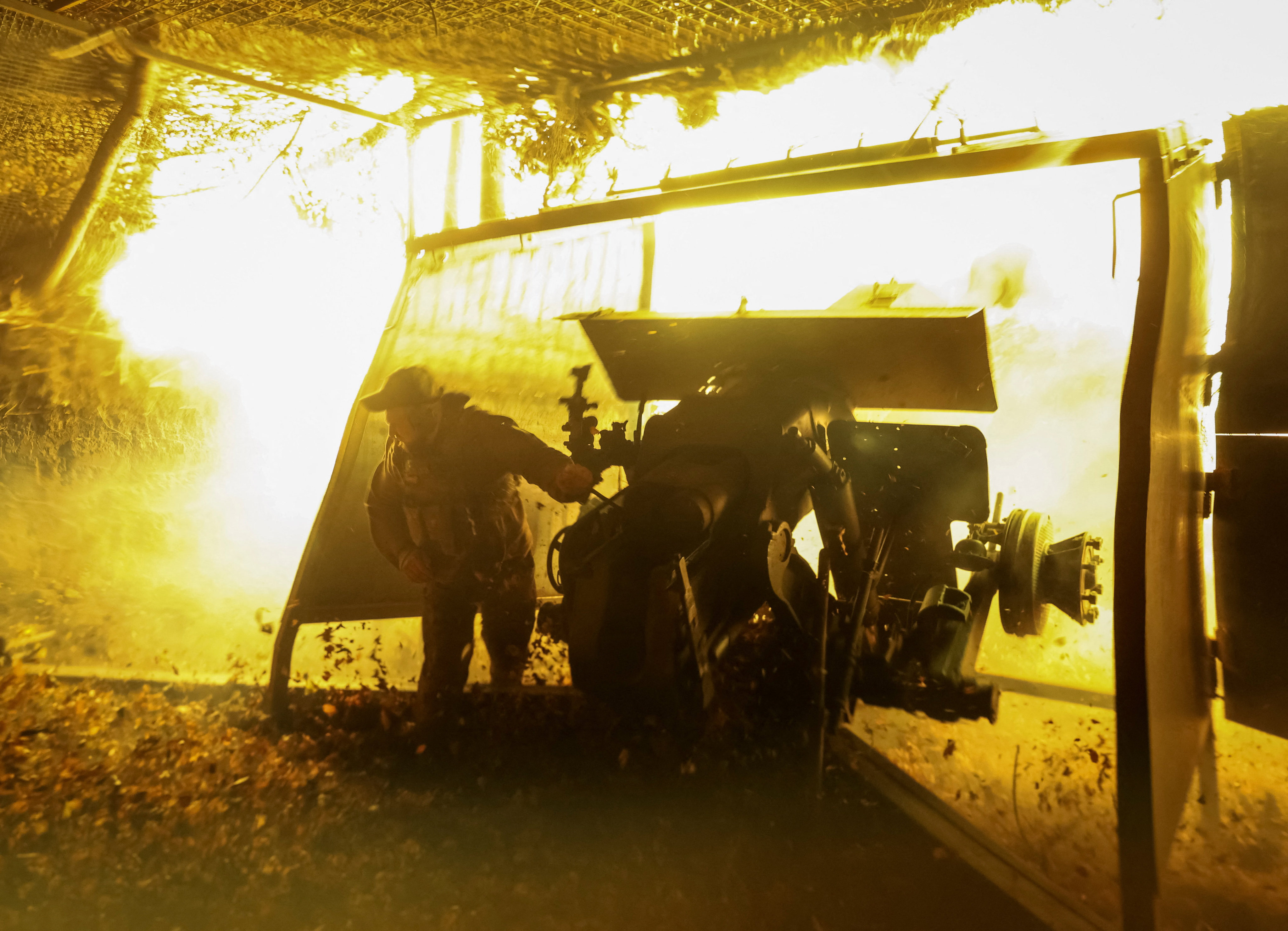 A Ukrainian artilleryman fires a howitzer towards Russian troops near the town of Kupiansk in the Kharkiv region on Friday. Photo: Reuters