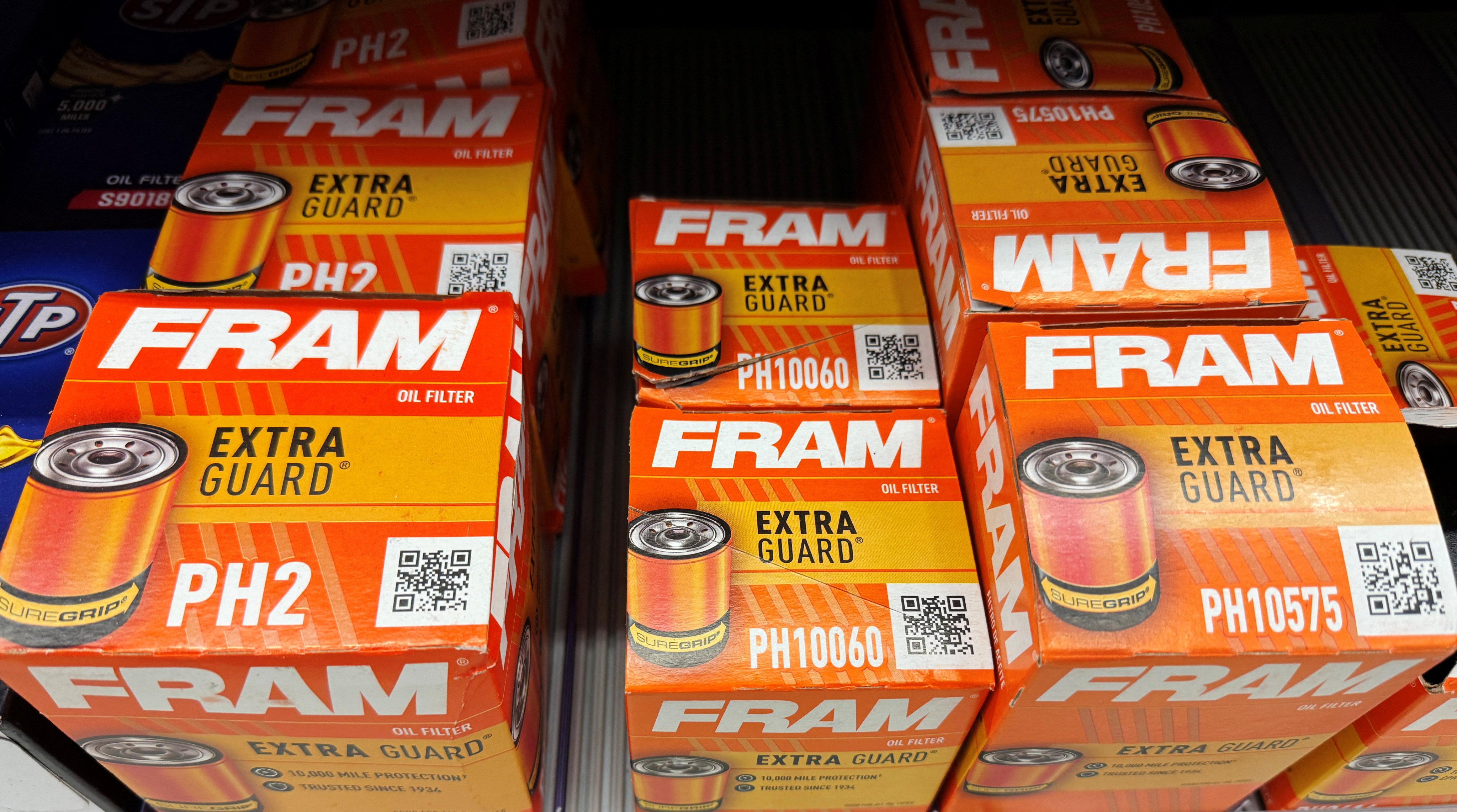 Fram oil filters, manufactured by the auto parts maker First Brands, are displayed for sale in Medford, Massachusetts, on October 21. The recent bankruptcies of First Brands and auto dealership Tricolor have raised fears of much bigger financial problems to come. Photo: Reuters