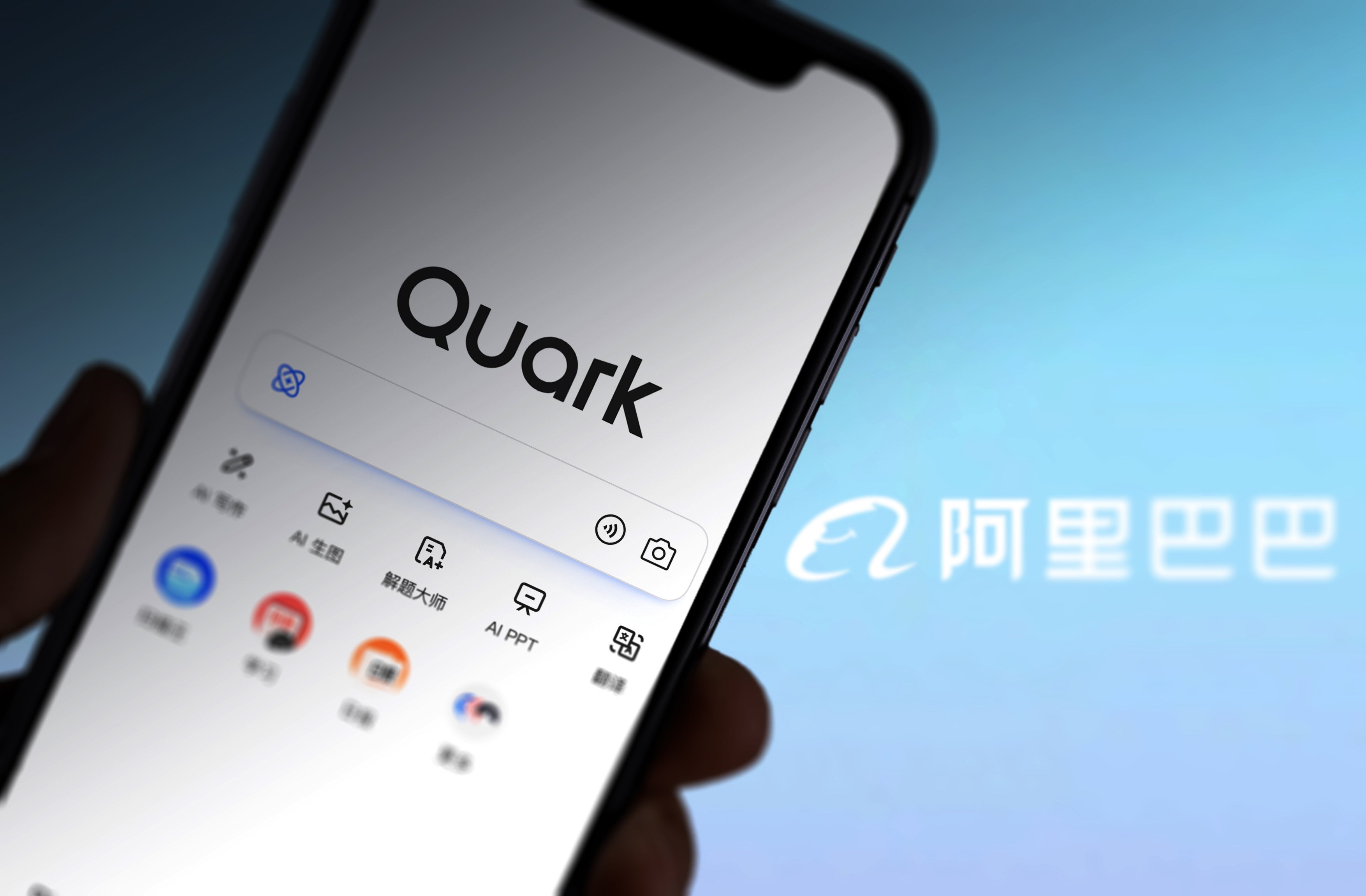 In this photo illustration taken March 13, 2025, the Quark page is displayed on a smartphone screen with the Alibaba logo in the background. Photo: VCG via Getty Images