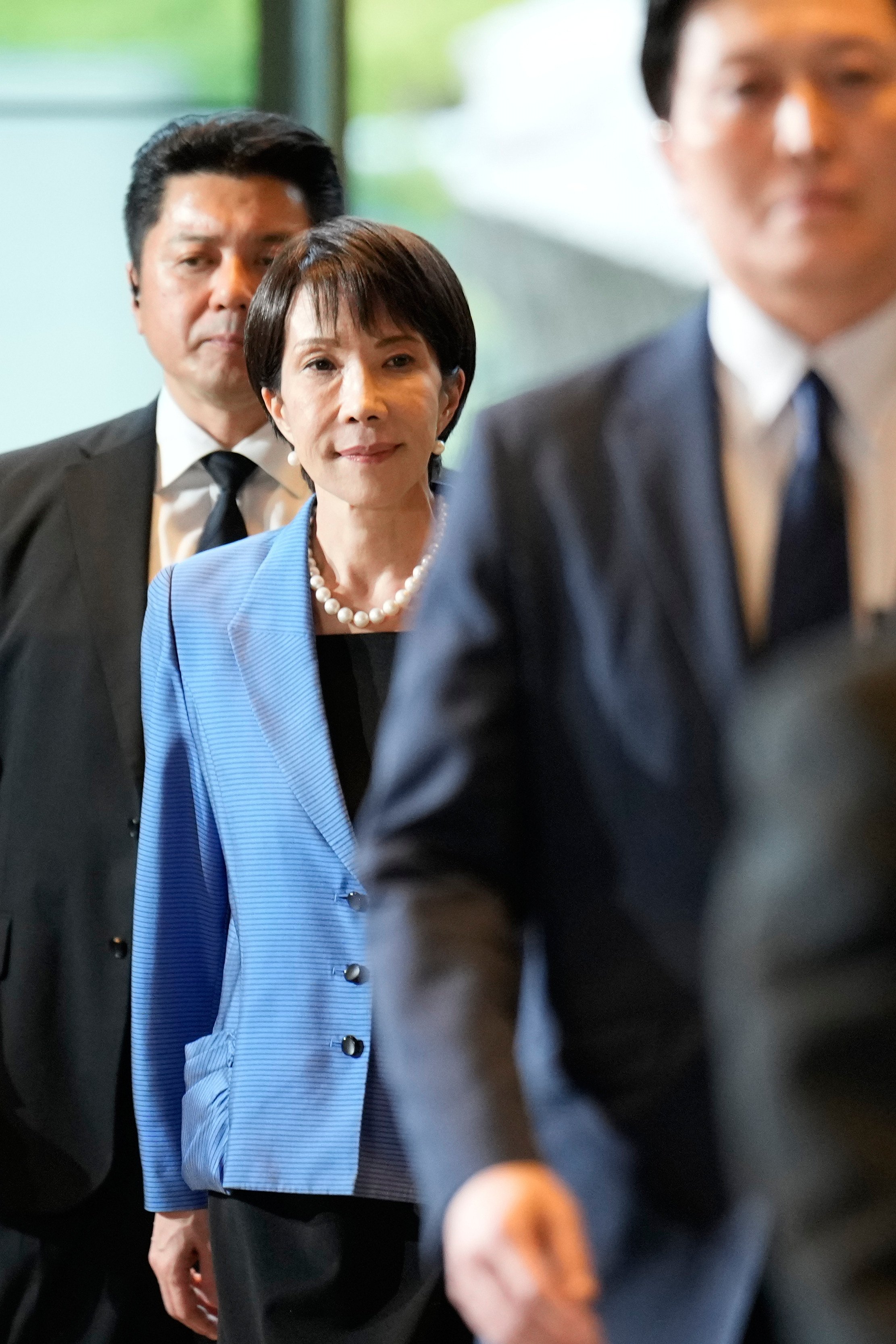 Japan’s newly elected Prime Minister Sanae Takaichi arrives at her official workplace in Tokyo on Tuesday. Photo: AP