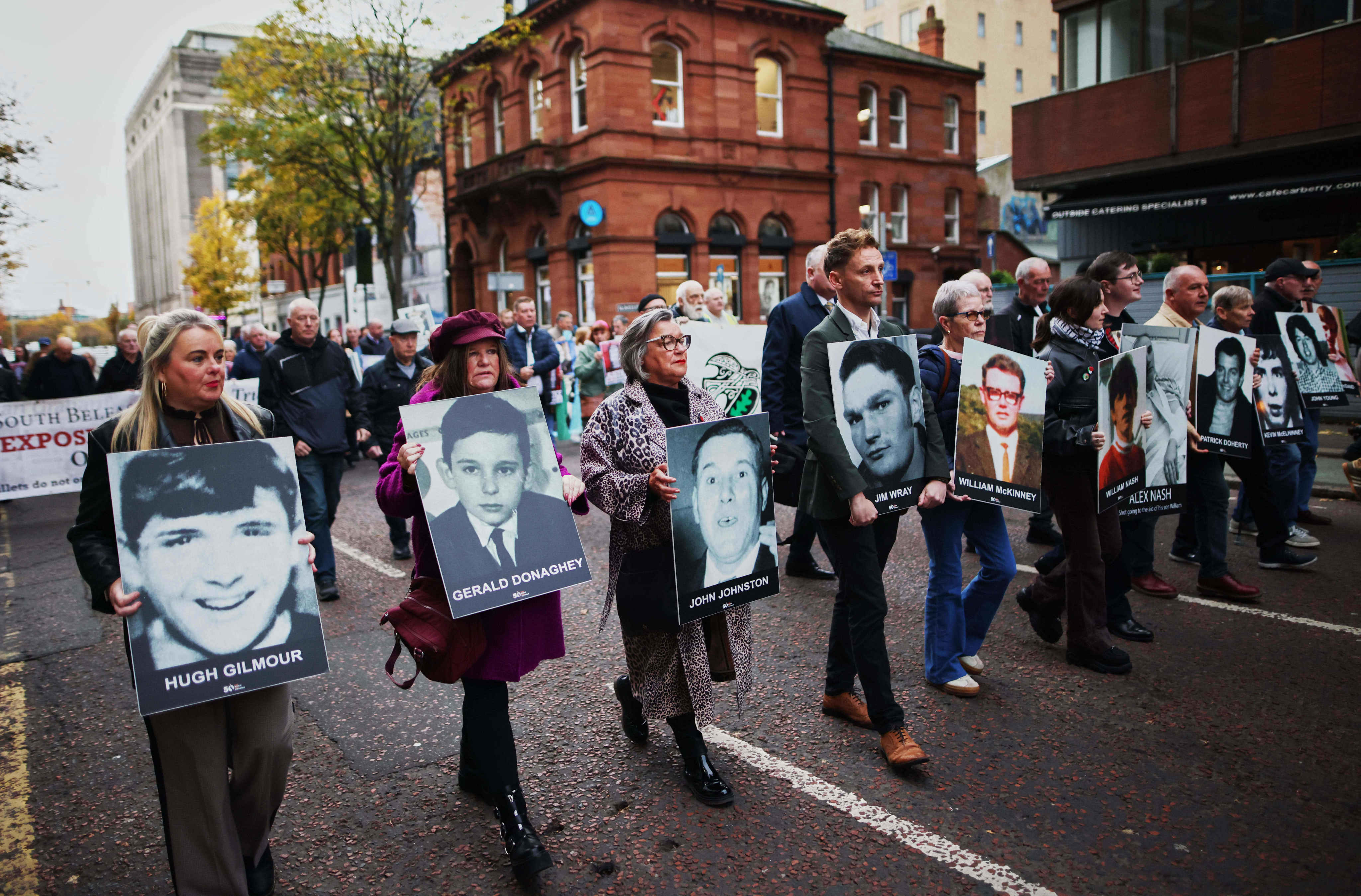 Relatives and supporters of the victims of the 1972 Bloody Sunday massacre march to Belfast Crown Court ahead of the verdict on the trial of a British soldier identified only as Soldier F, Belfast, in Northern Ireland, on Thursday. Photo: AP