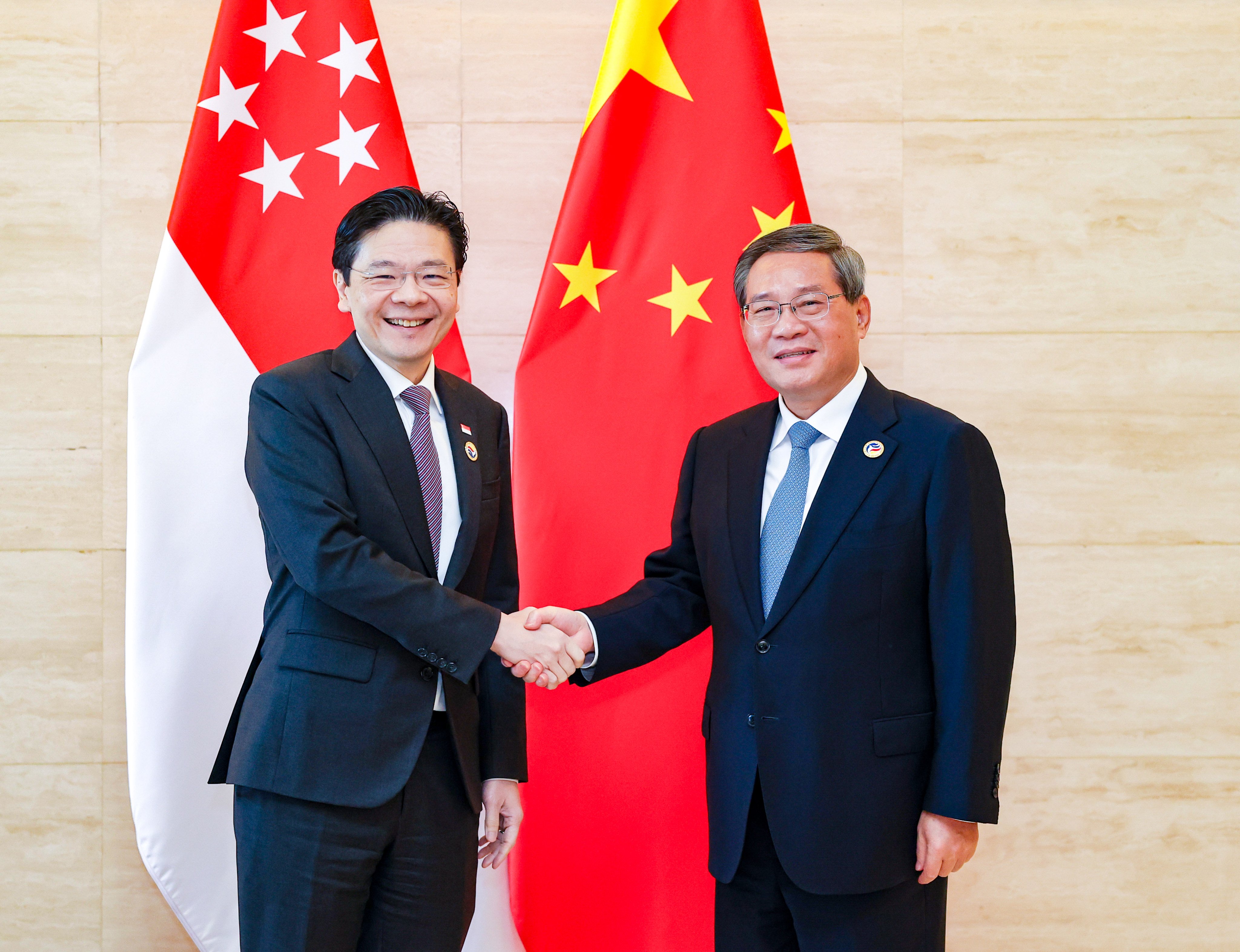 Chinese Premier Li Qiang (right) is expected to meet Singaporean Prime Minister Lawrence Wong (left) during his trip to the city state. Photo: Xinhua