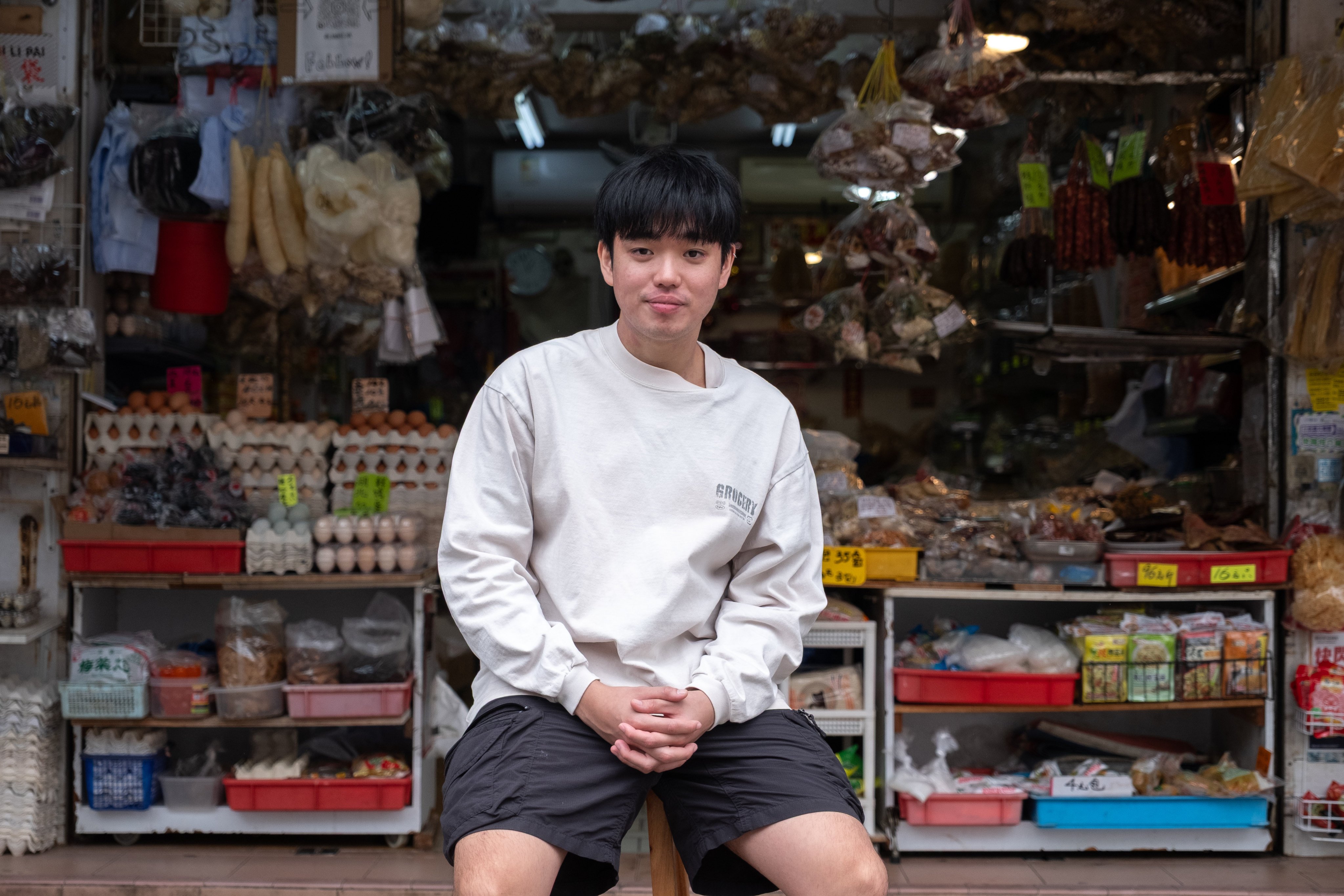 Tony Lam, 22, at his family’s Lam Kee Grocery Shop in Kowloon City. Photo: Connor Mycroft