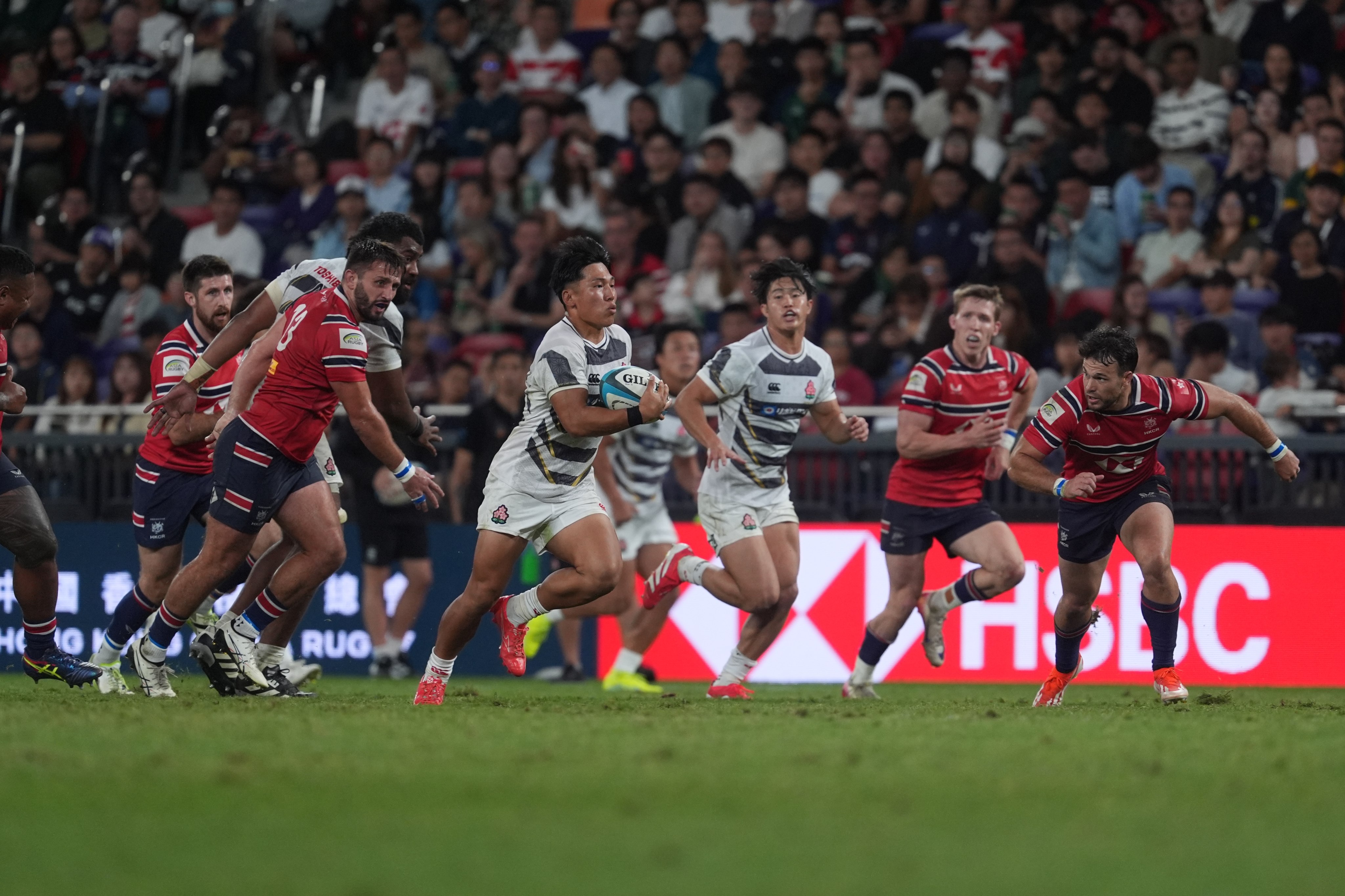 Japan centre Yuto Mori races clear of the Hong Kong defence on the way to scoring one of his side’s nine tries. Photo: Elson Li