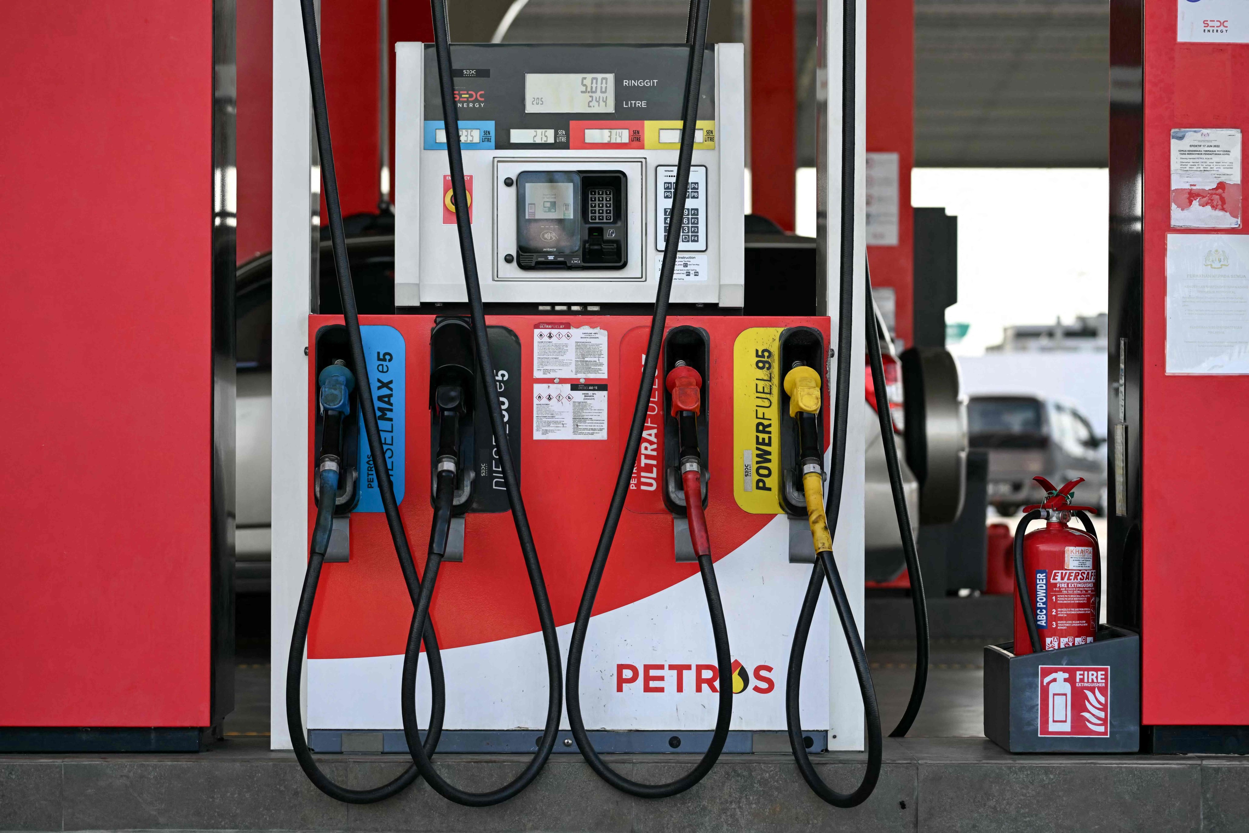 Fuel pump nozzles are seen at a petrol station in Sarawak, Malaysia. Photo: AFP