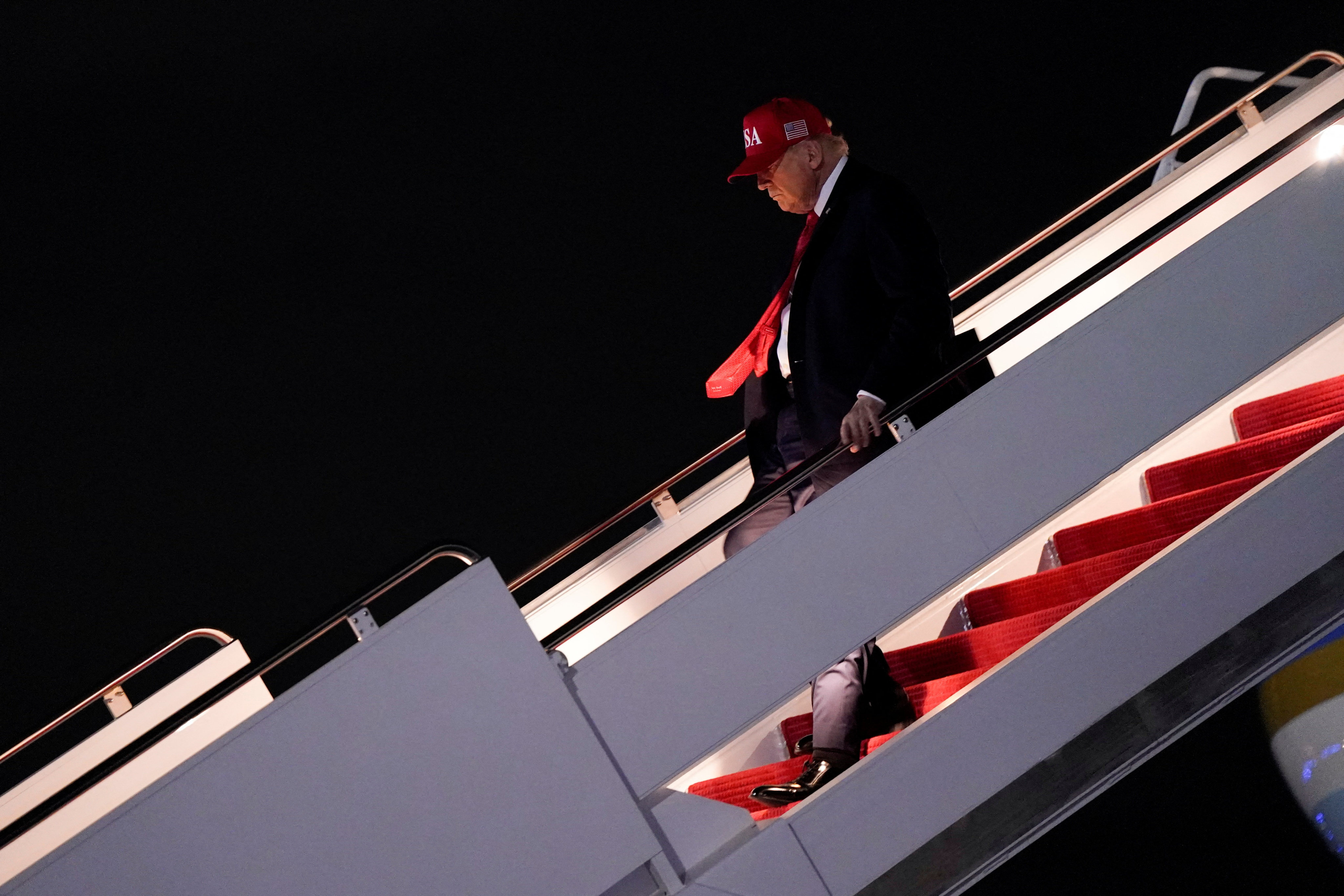 US President Donald Trump disembarks Air Force One en route to Washington at Joint Base Andrews in Maryland on October 19. Photo: Reuters