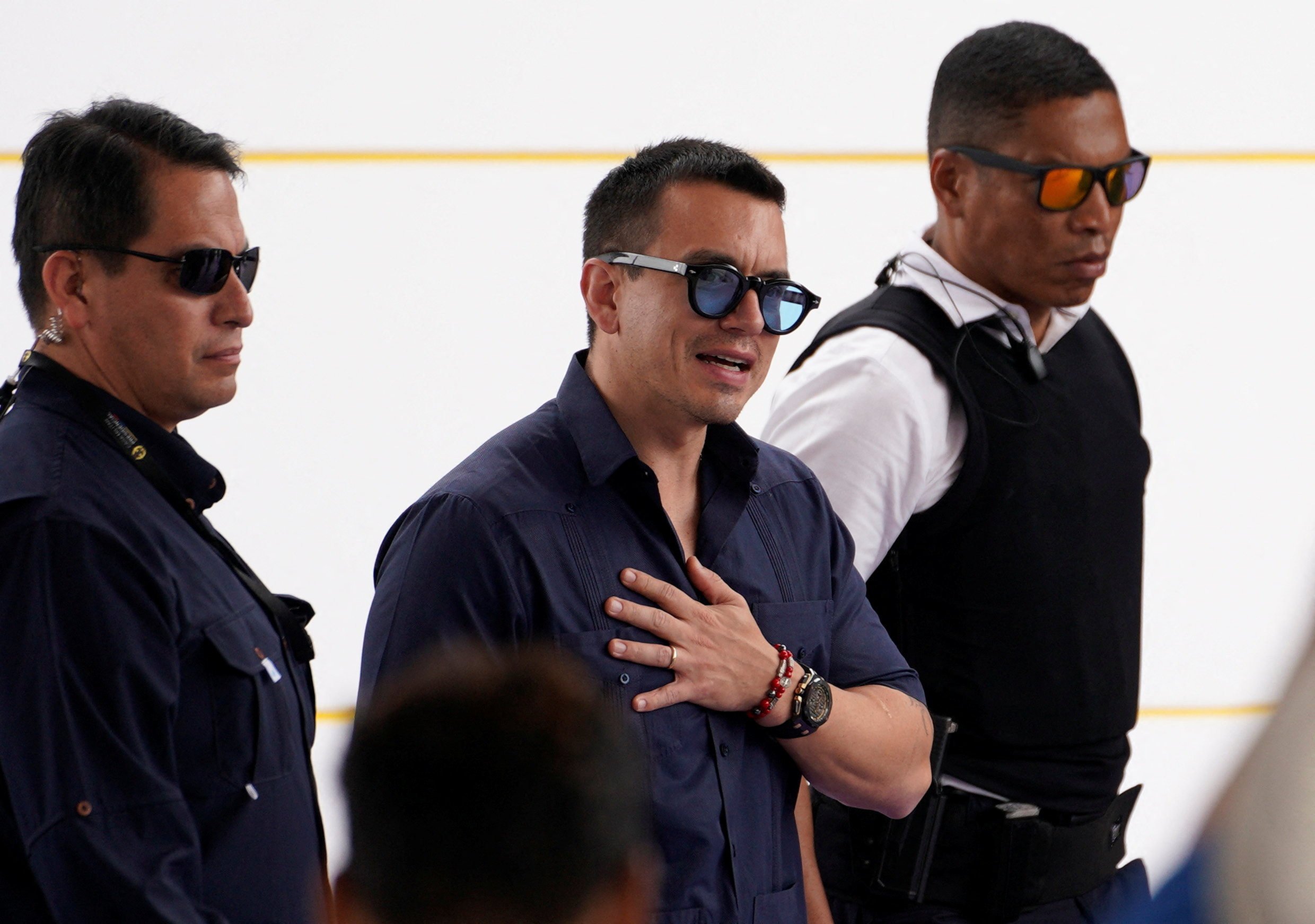 Ecuador’s President Daniel Noboa being escorted by security personnel. Photo: Reuters