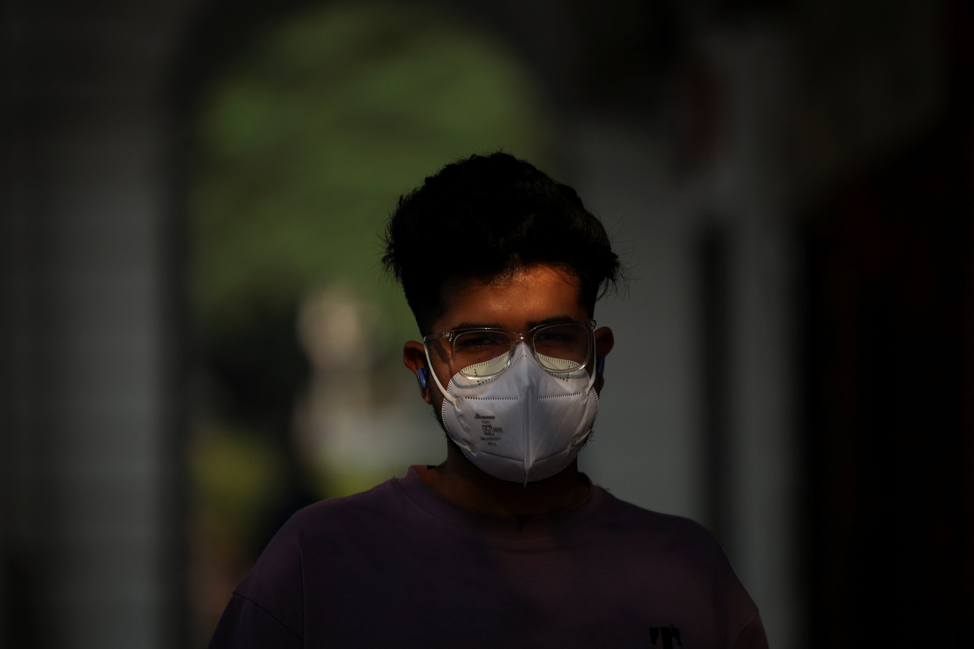 A man in Delhi walks with a face mask on Thursday after the air quality dipped again. Photo: Reuters