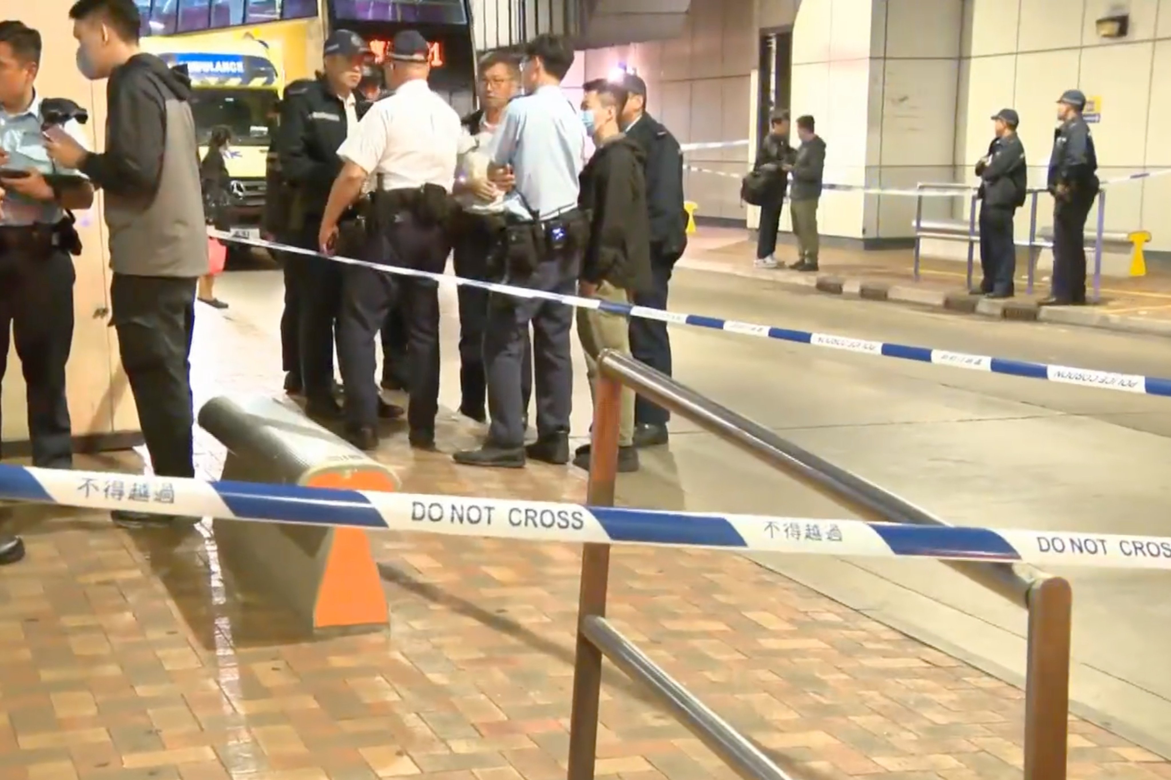 Police examine the spot where a 20-year-old man was attacked on Wednesday night. Photo: Cable TV News