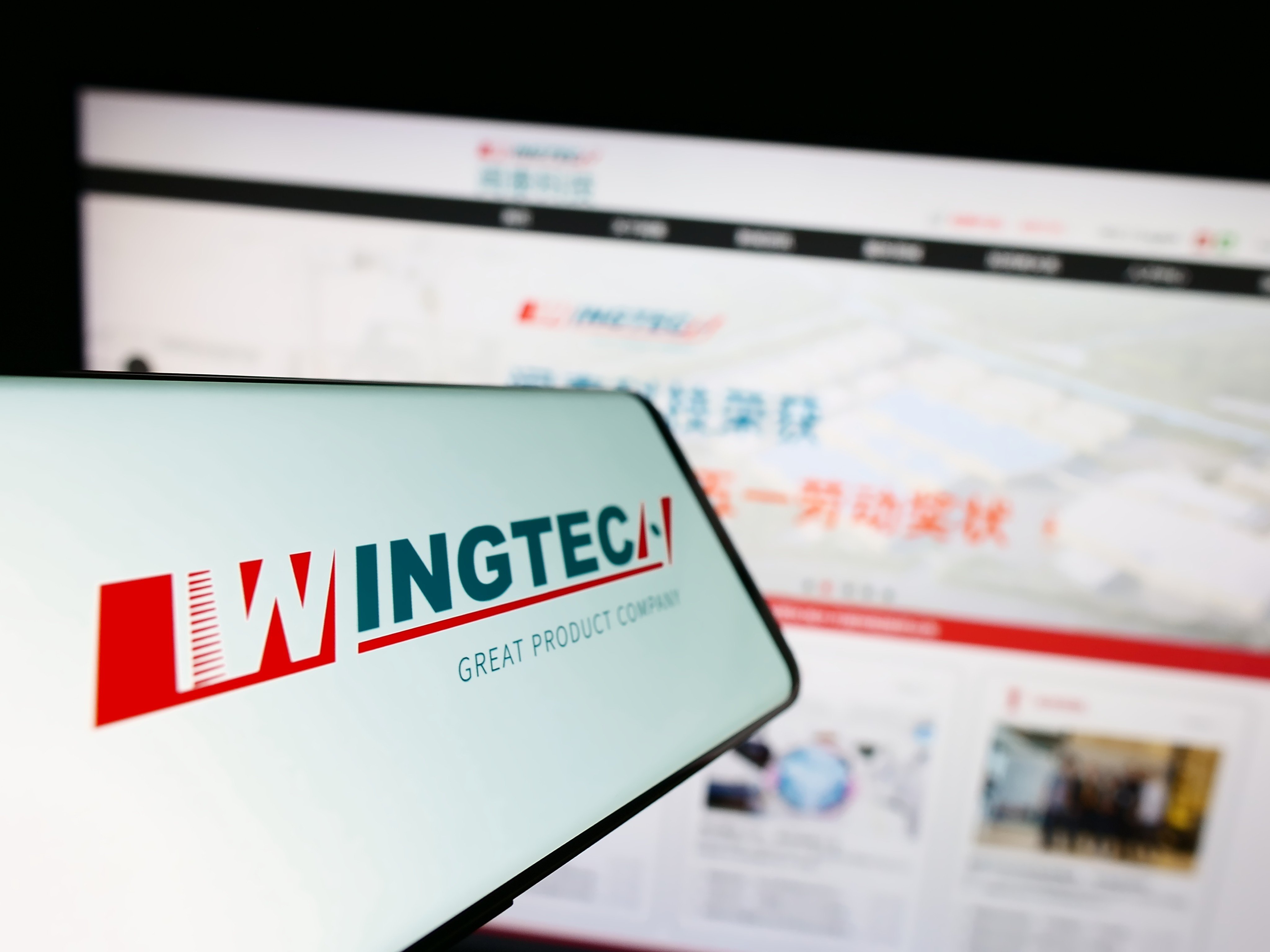 A smartphone displays the logo of Wingtech Technology. Photo: Shutterstock Images