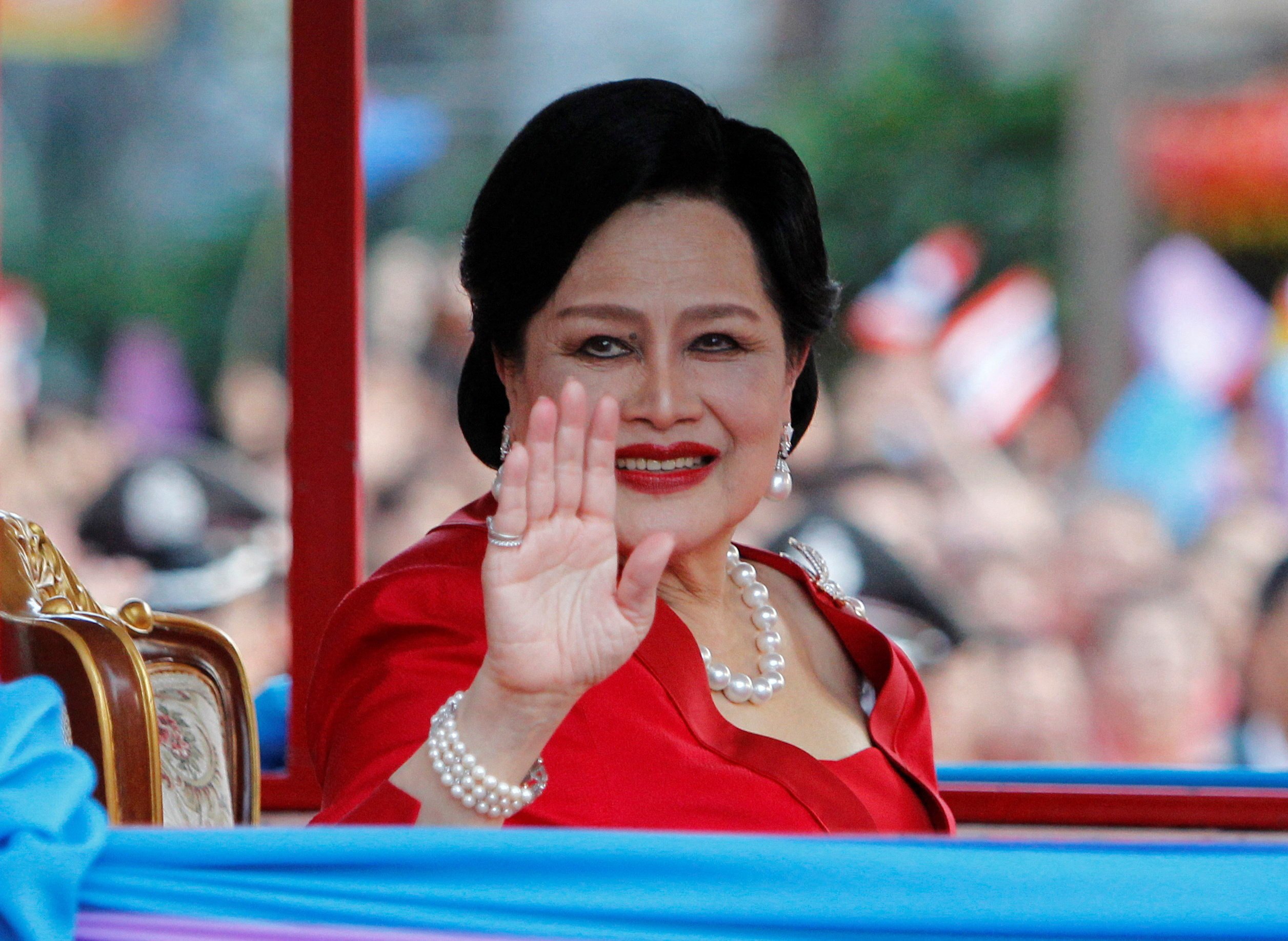 Thailand’s Queen Sirikit waves to people during her arrival in Chinatown for Lunar New Year celebrations in Bangkok in January 2012. Photo: Reuters