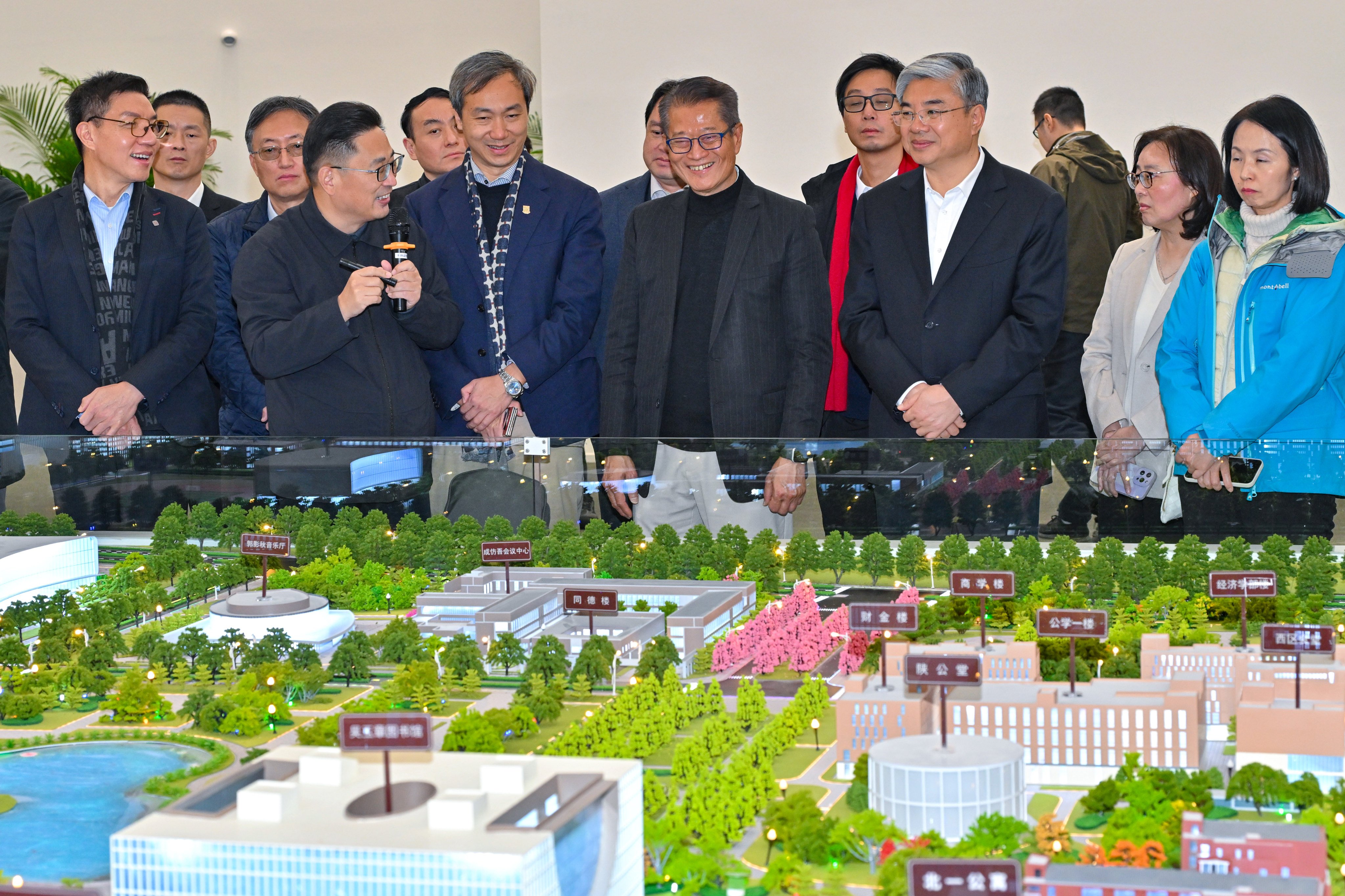 Financial Secretary Paul Chan (front row, fourth right) led a delegation to the mainland, with a look at the development of the Tongzhou campus of Renmin University of China one of the stops. Photo: Handout