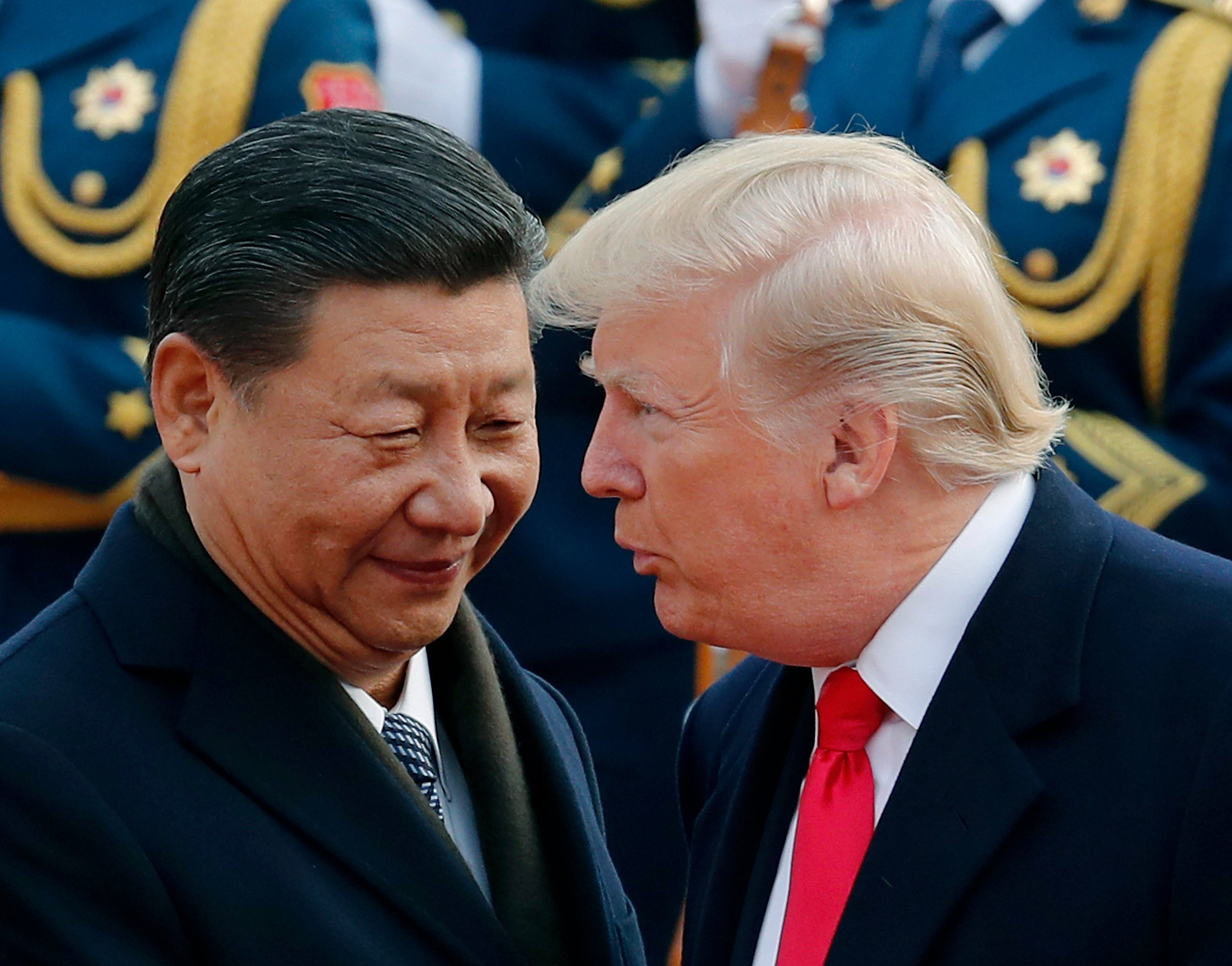 US President Donald Trump chats with Chinese President Xi Jinping during a welcome ceremony at the Great Hall of the People in Beijing in November 2017. Photo: AP