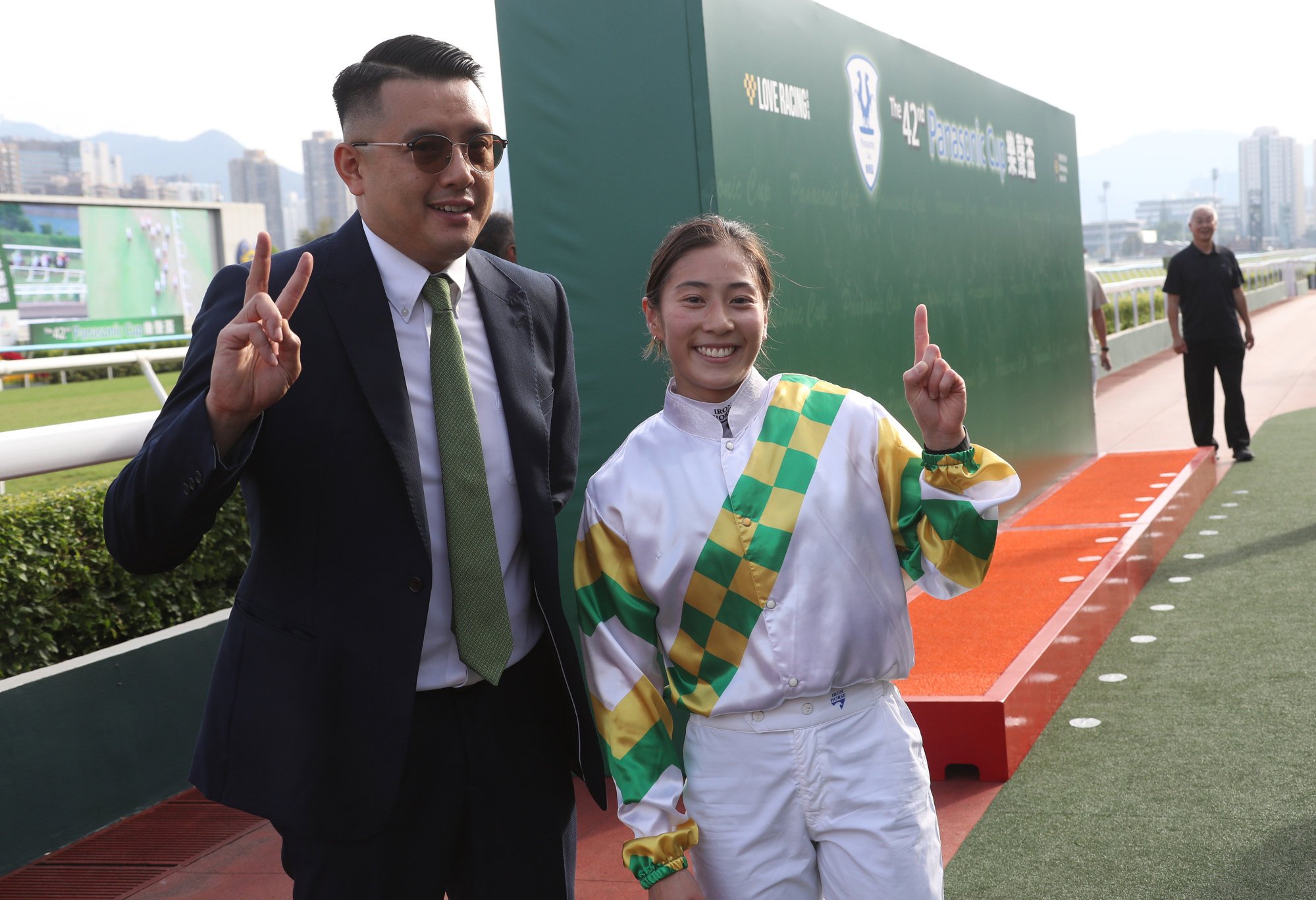 Trainer Pierre Ng and apprentice Britney Wong celebrate Sagacious Life’s win.