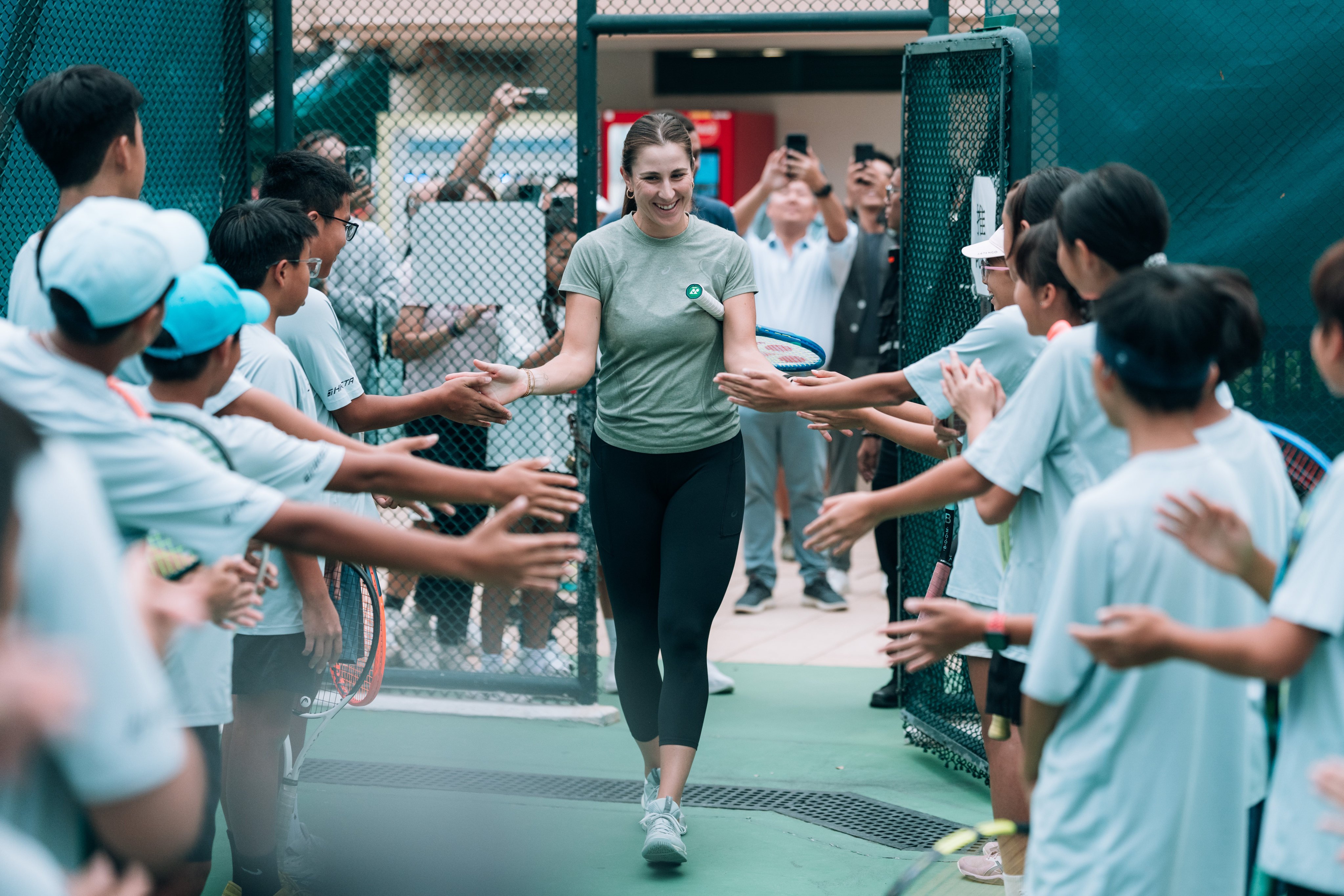 Belinda Bencic arrives for a practice session with some of Hong Kong’s talented youngsters. Photo: HKCTA