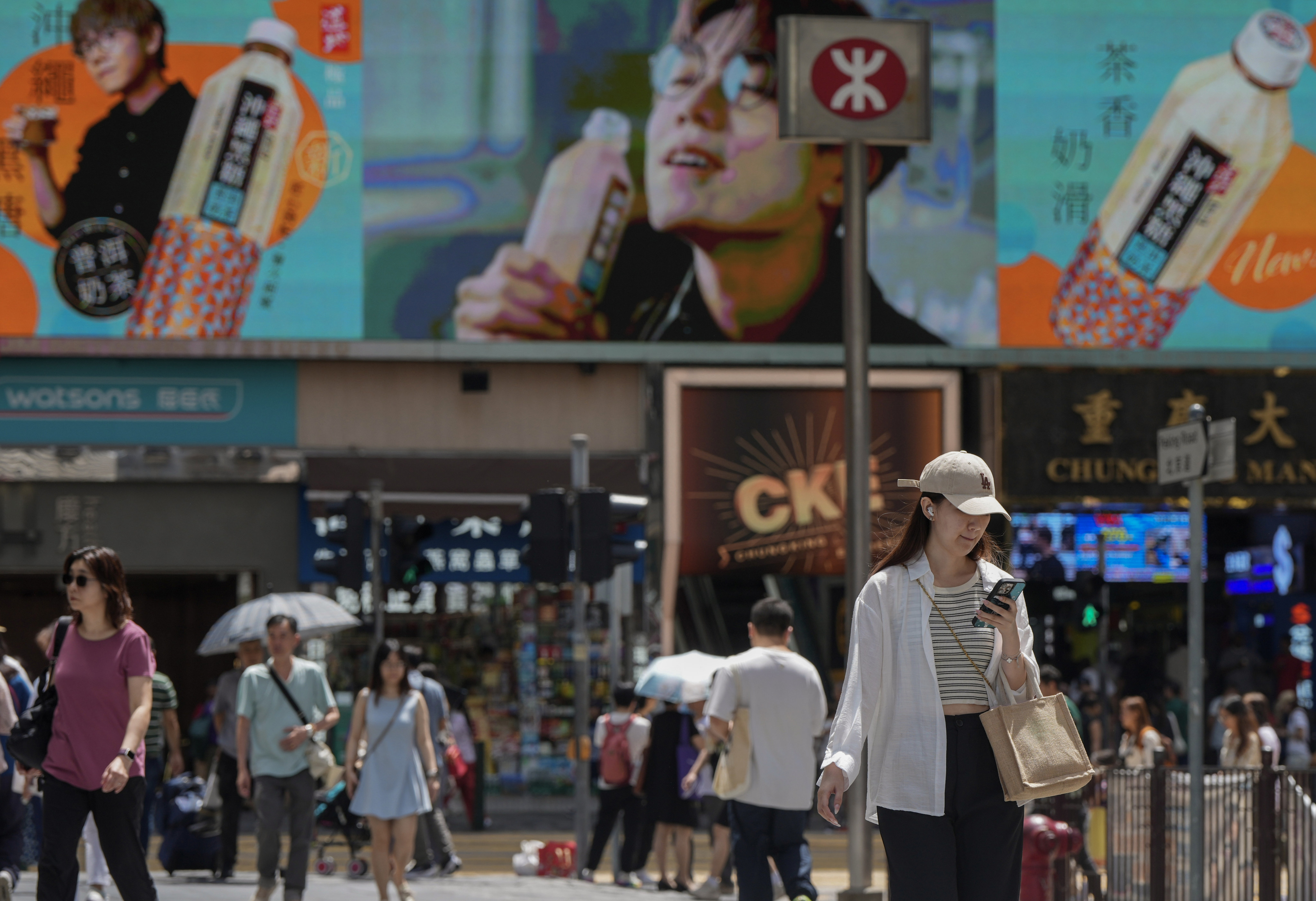 Commuters in Hong Kong’s Tsim Sha Tsui district on September 1. Revenue in Hong Kong’s retail and hospitality industries in the second quarter of this year was 10-20 per cent below 2018 levels. Photo: Sam Tsang