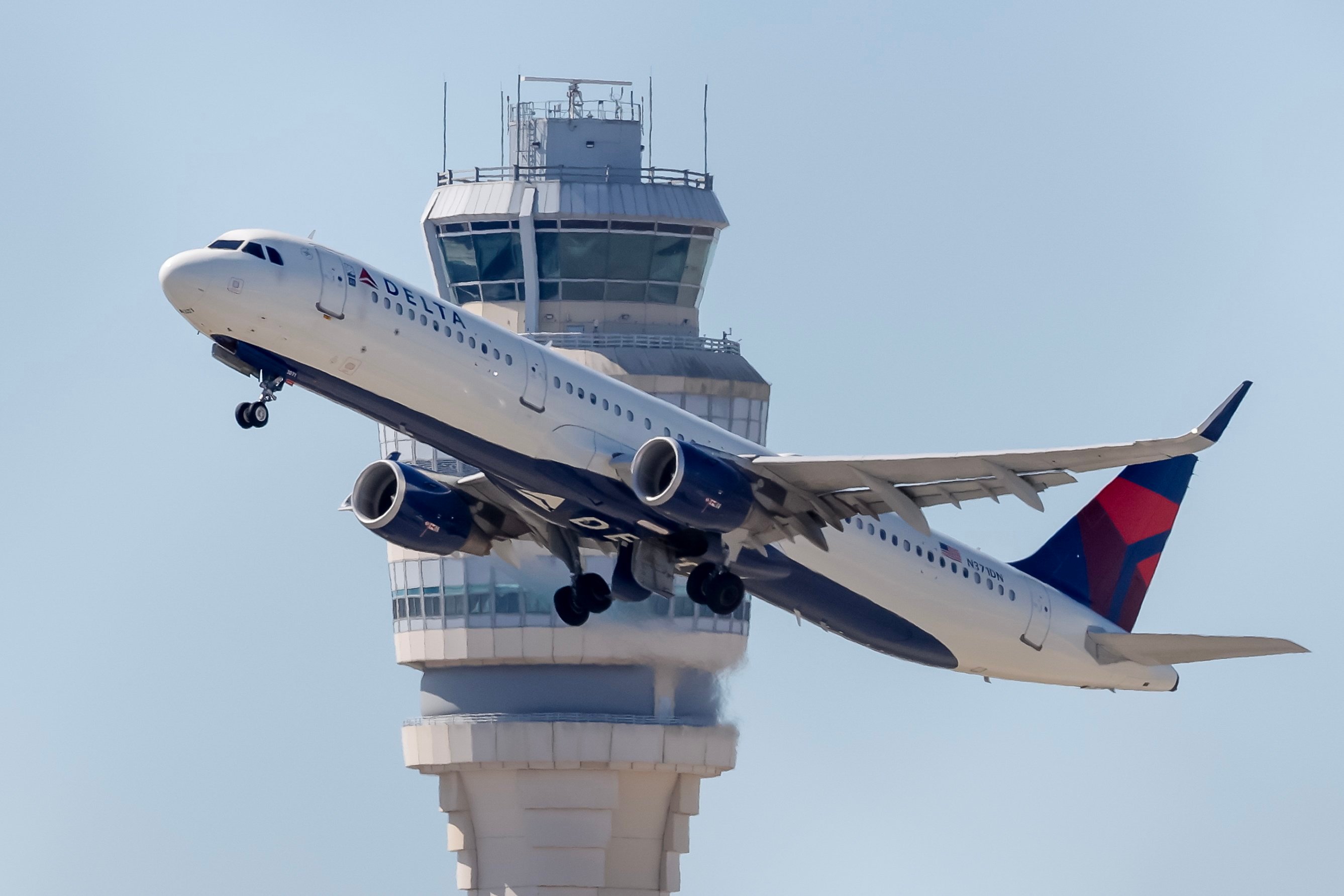 A Delta Air Lines flight passes in front of the Air Traffic Control tower while departing from Hartsfield-Jackson Atlanta International Airport in Atlanta, Georgia. Photo: EPA