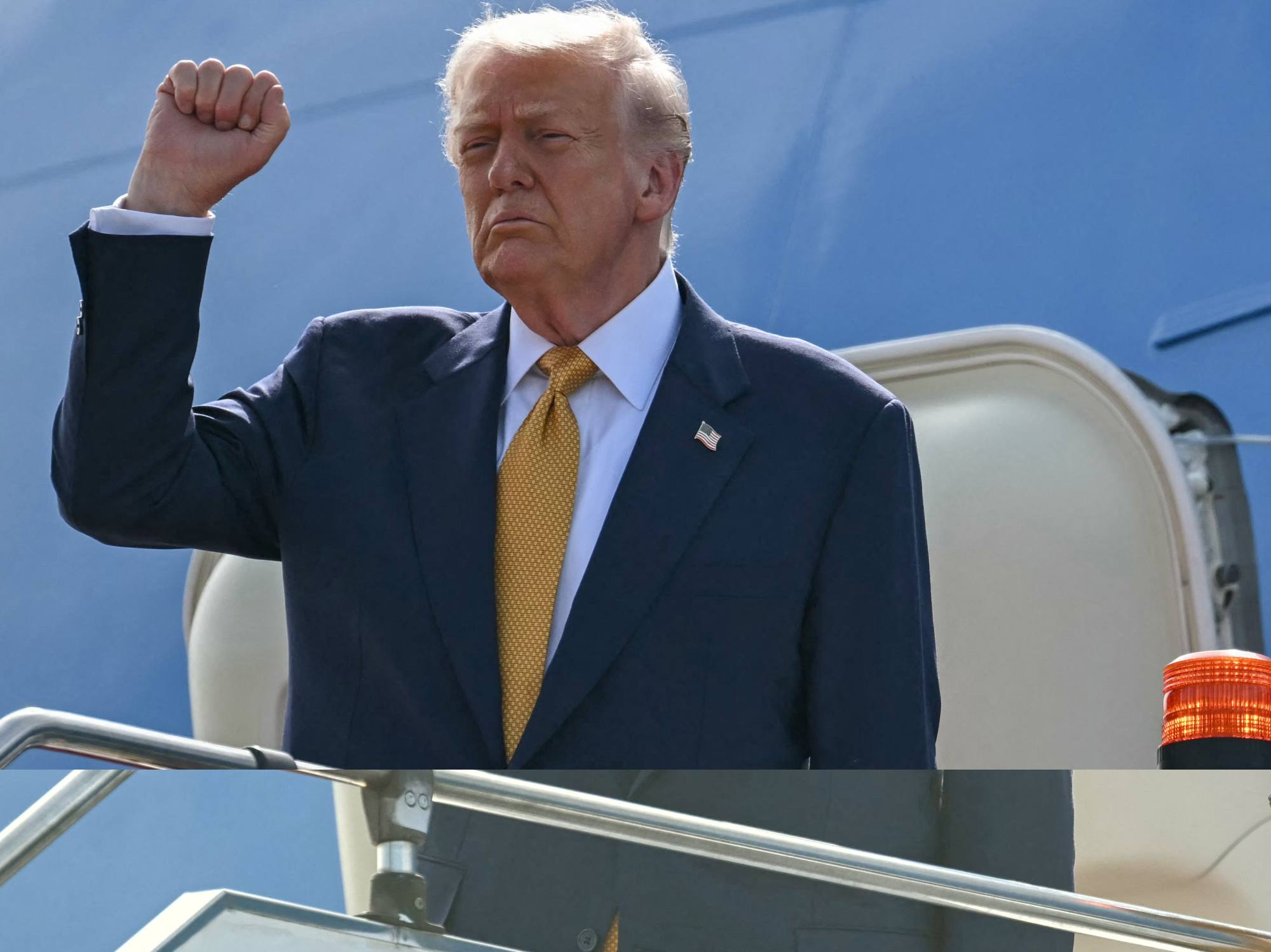 US President Donald Trump gestures as he departs on Air Force One from Kuala Lumpur International Airport on Monday. Photo: AFP US President Donald Trump gestures as he departs on Air Force One from Kuala Lumpur International Airport on Monday. Photo: AFP