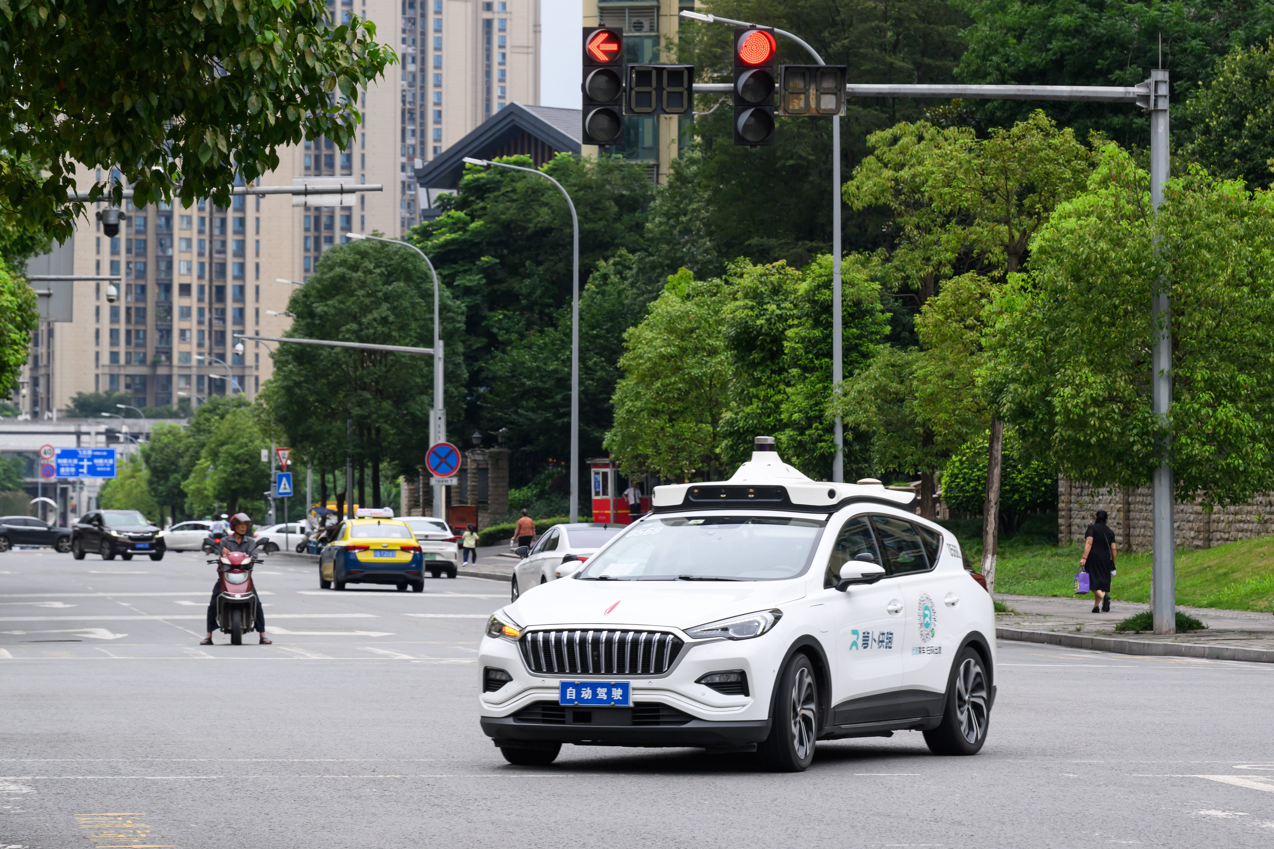 A Baidu Apollo Go robotaxi drives on the road in Chongqing, China, on July 10, 2024. Photo: China News Service/VCG via Getty Images