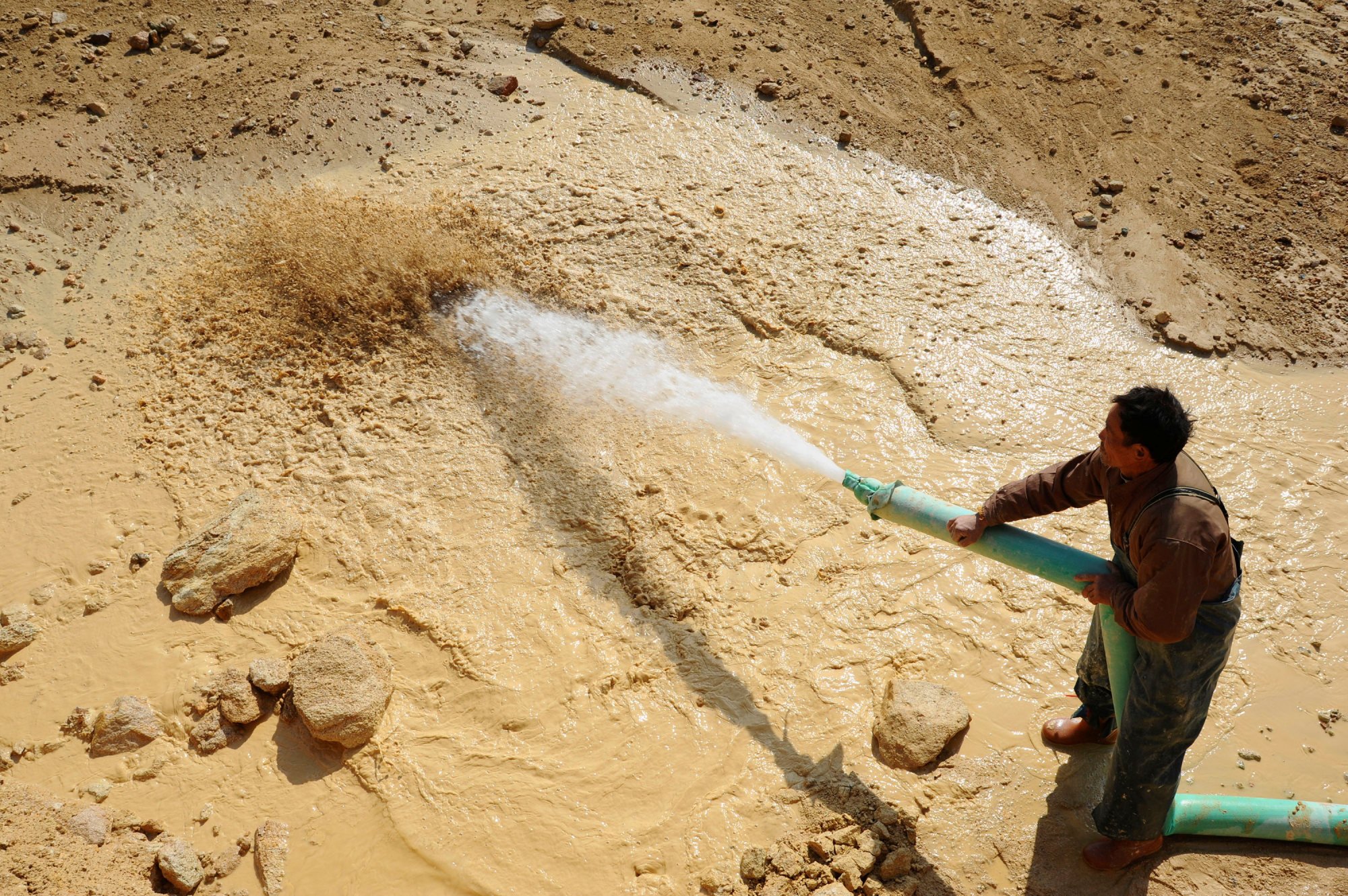 A worker waters the site of a rare earth metals mine at Nancheng county, Jiangxi province. China accounts for about 90 per cent of the world’s processed rare earths supply. Photo: Reuters A worker waters the site of a rare earth metals mine at Nancheng county, Jiangxi province. China accounts for about 90 per cent of the world’s processed rare earths supply. Photo: Reuters
