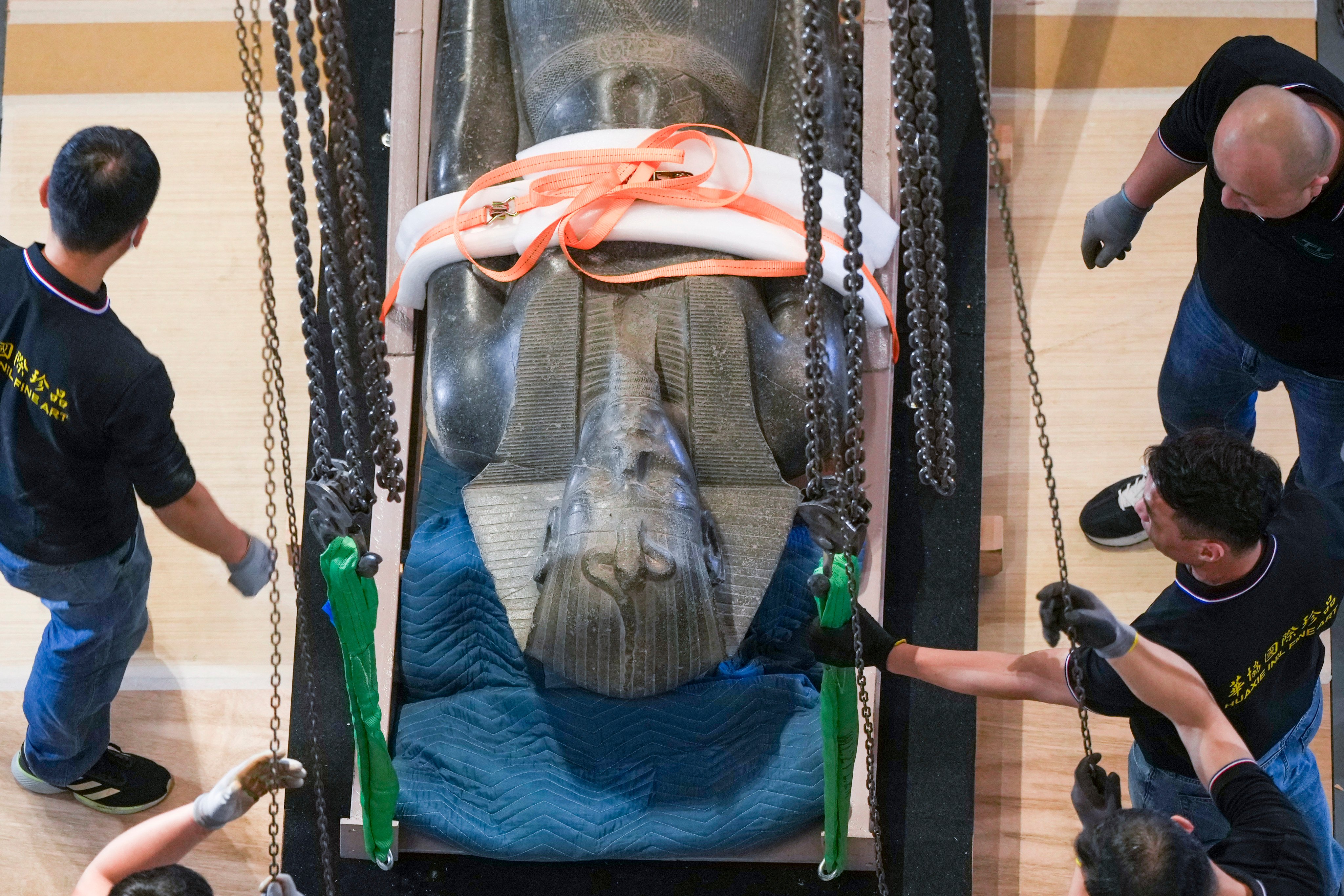 A 2.4-metre (7.9-foot) tall statue of the pharaoh Merenptah is uncrated at the Hong Kong Palace Museum. Photo: Sam Tsang