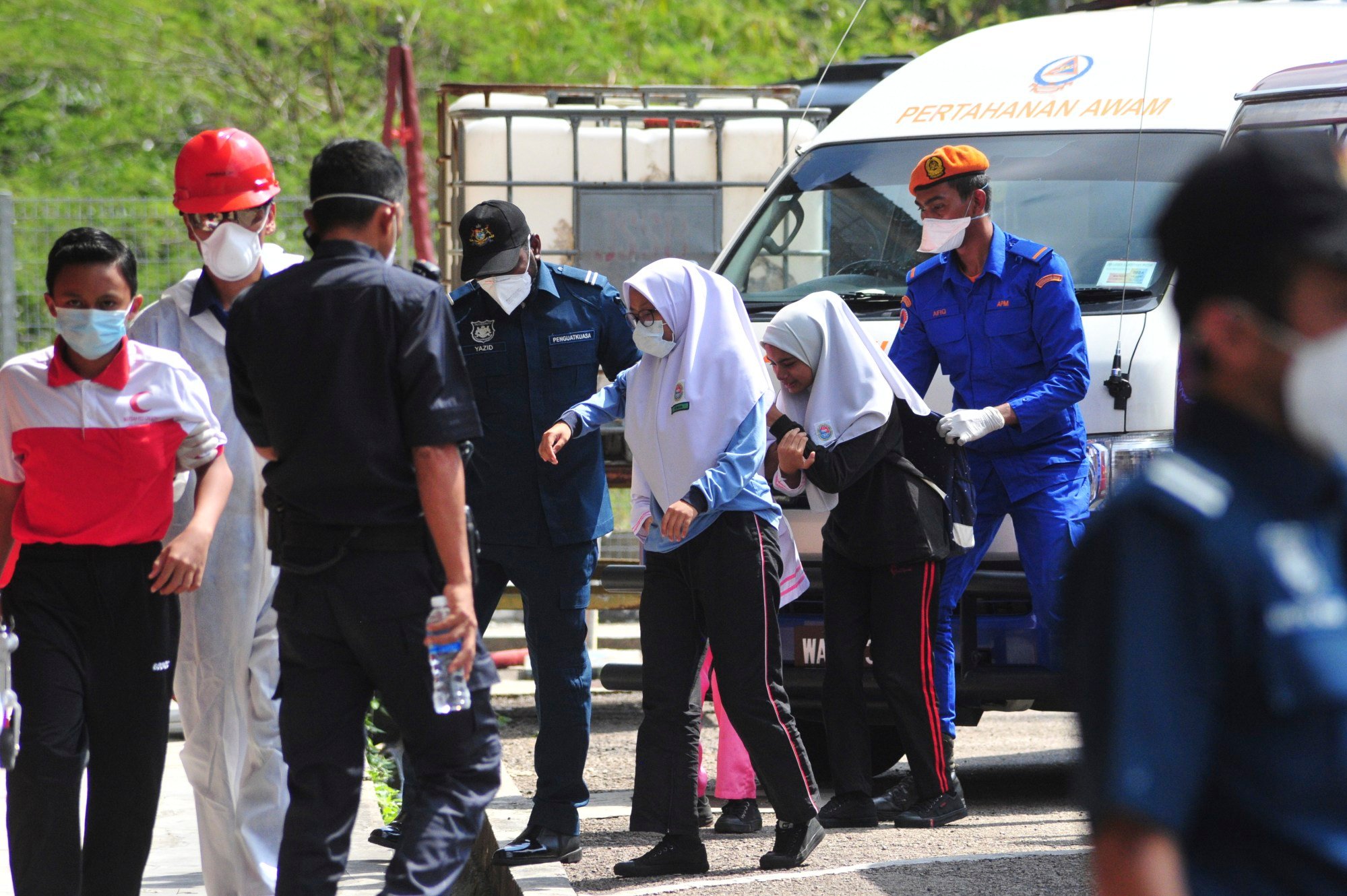 Students evacuated from a school after a toxic chemical spill in Pasir Gudang, Johor, Malaysia in 2019. Malaysia’s education ministry ordered 34 schools to be closed in Johor over the spill. Photo: AP Students evacuated from a school after a toxic chemical spill in Pasir Gudang, Johor, Malaysia in 2019. Malaysia’s education ministry ordered 34 schools to be closed in Johor over the spill. Photo: AP