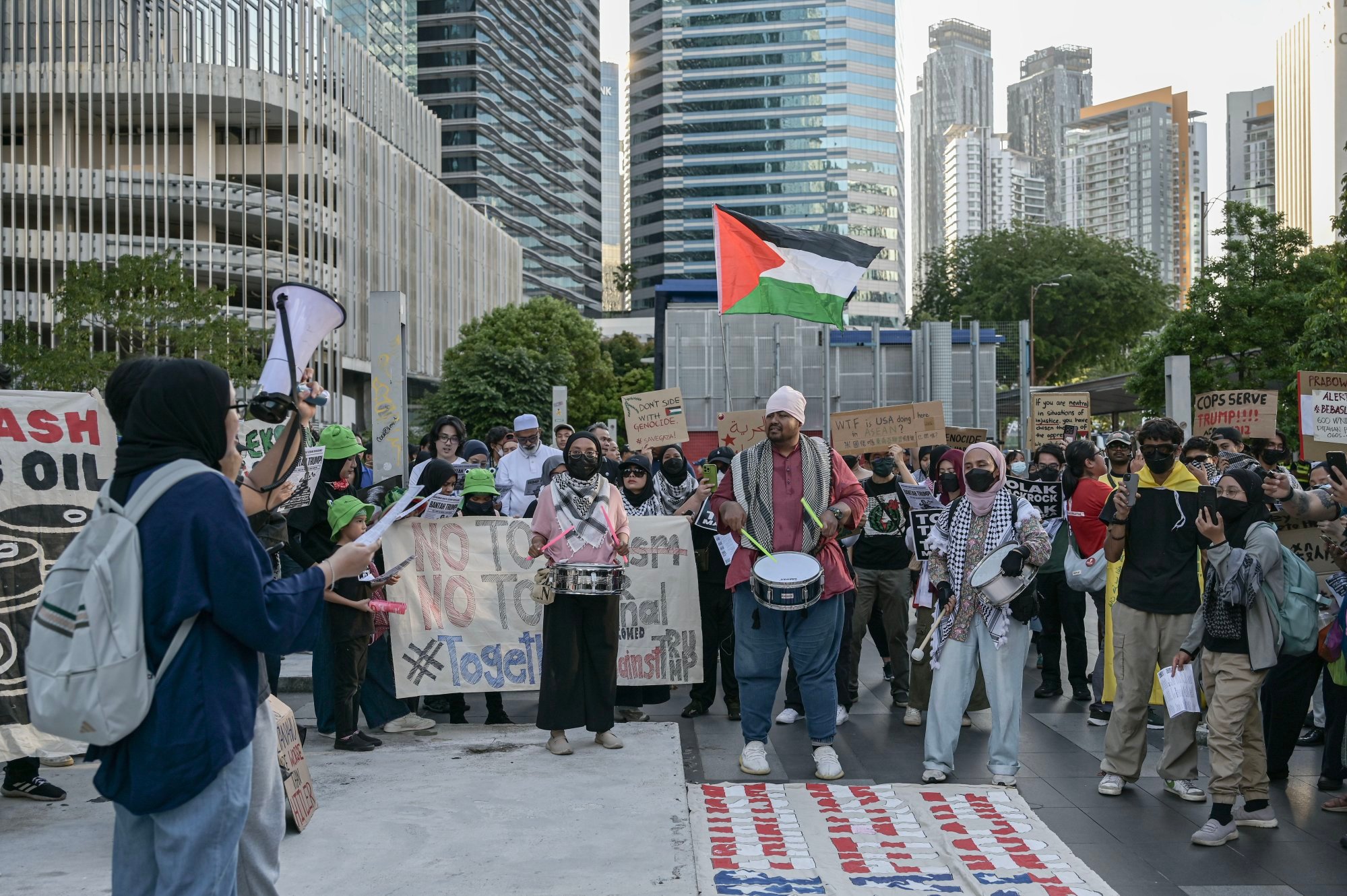 Protesters display placards during a rally against US President Donald Trump’s visit to Malaysia to attend the Asean summit at Ampang Park in Kuala Lumpur, Malaysia, on Sunday. Photo: EPA Protesters display placards during a rally against US President Donald Trump’s visit to Malaysia to attend the Asean summit at Ampang Park in Kuala Lumpur, Malaysia, on Sunday. Photo: EPA