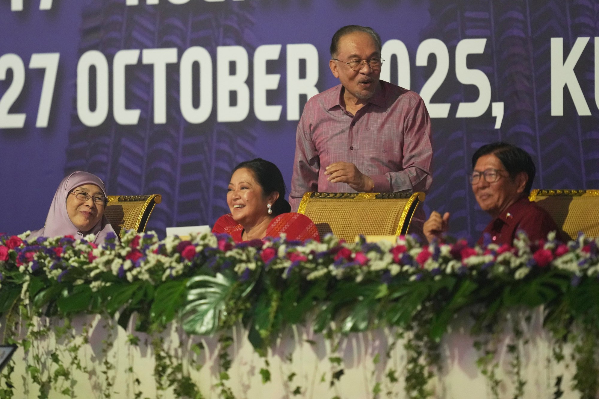 Malaysia’s Prime Minister Anwar Ibrahim, Philippines President Ferdinand Marcos Jnr and their spouses share a light moment at a gala dinner of the Asean summit in Kuala Lumpur on Monday. Photo: AP Malaysia’s Prime Minister Anwar Ibrahim, Philippines President Ferdinand Marcos Jnr and their spouses share a light moment at a gala dinner of the Asean summit in Kuala Lumpur on Monday. Photo: AP