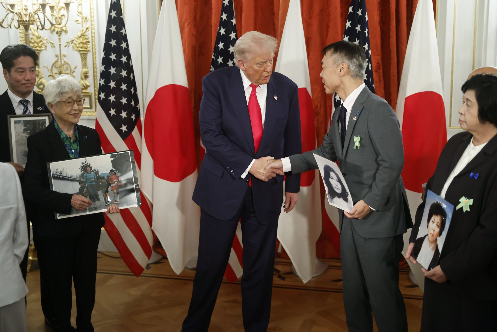 US President Donald Trump attends a meeting with relatives of Japanese nationals abducted by North Korea at the Akasaka Palace State Guest House in Tokyo on Tuesday. Photo: EPA US President Donald Trump attends a meeting with relatives of Japanese nationals abducted by North Korea at the Akasaka Palace State Guest House in Tokyo on Tuesday. Photo: EPA