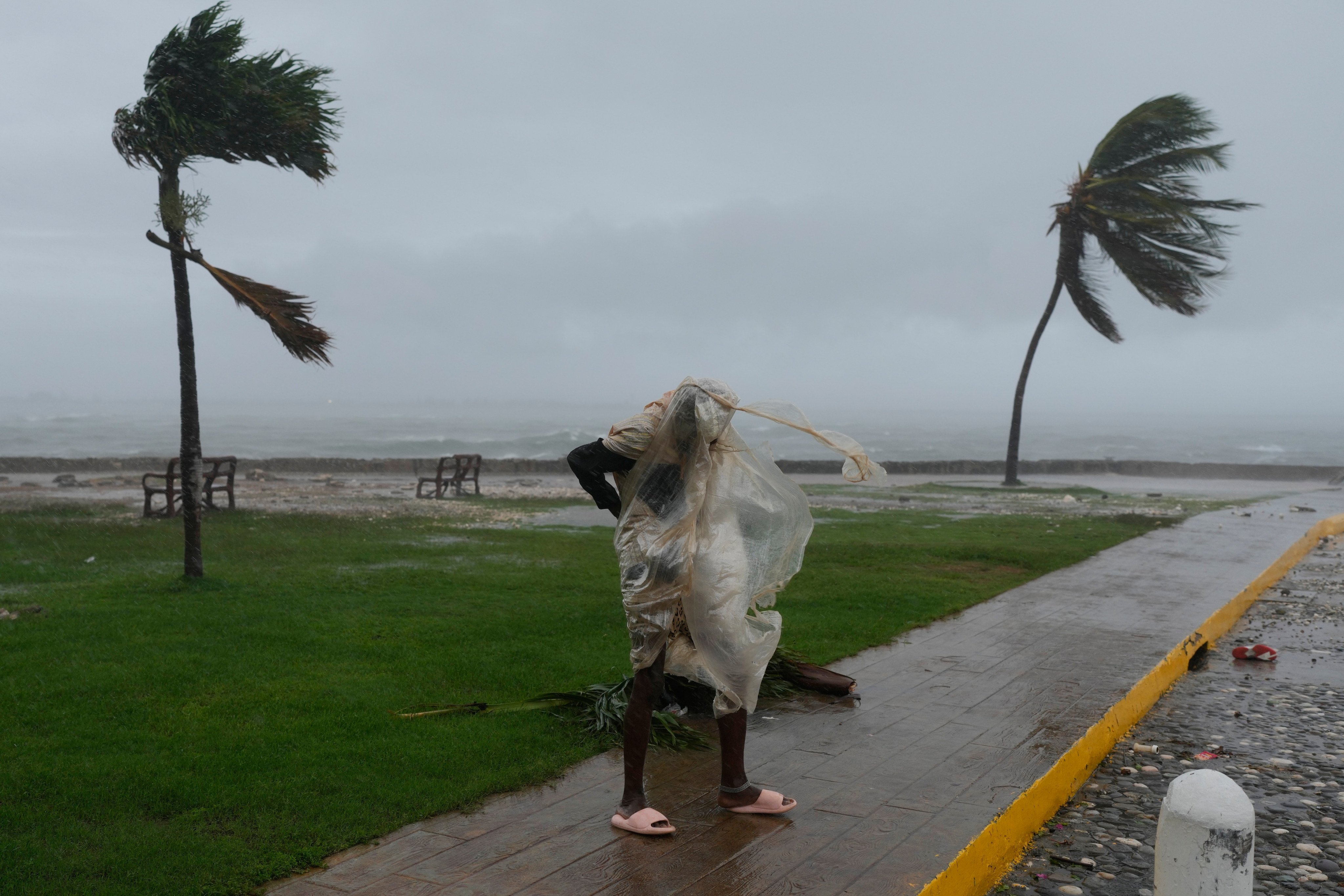 A man walks in Kingston, Jamaica, as Hurricane Melissa approaches on Tuesday. Photo: AP