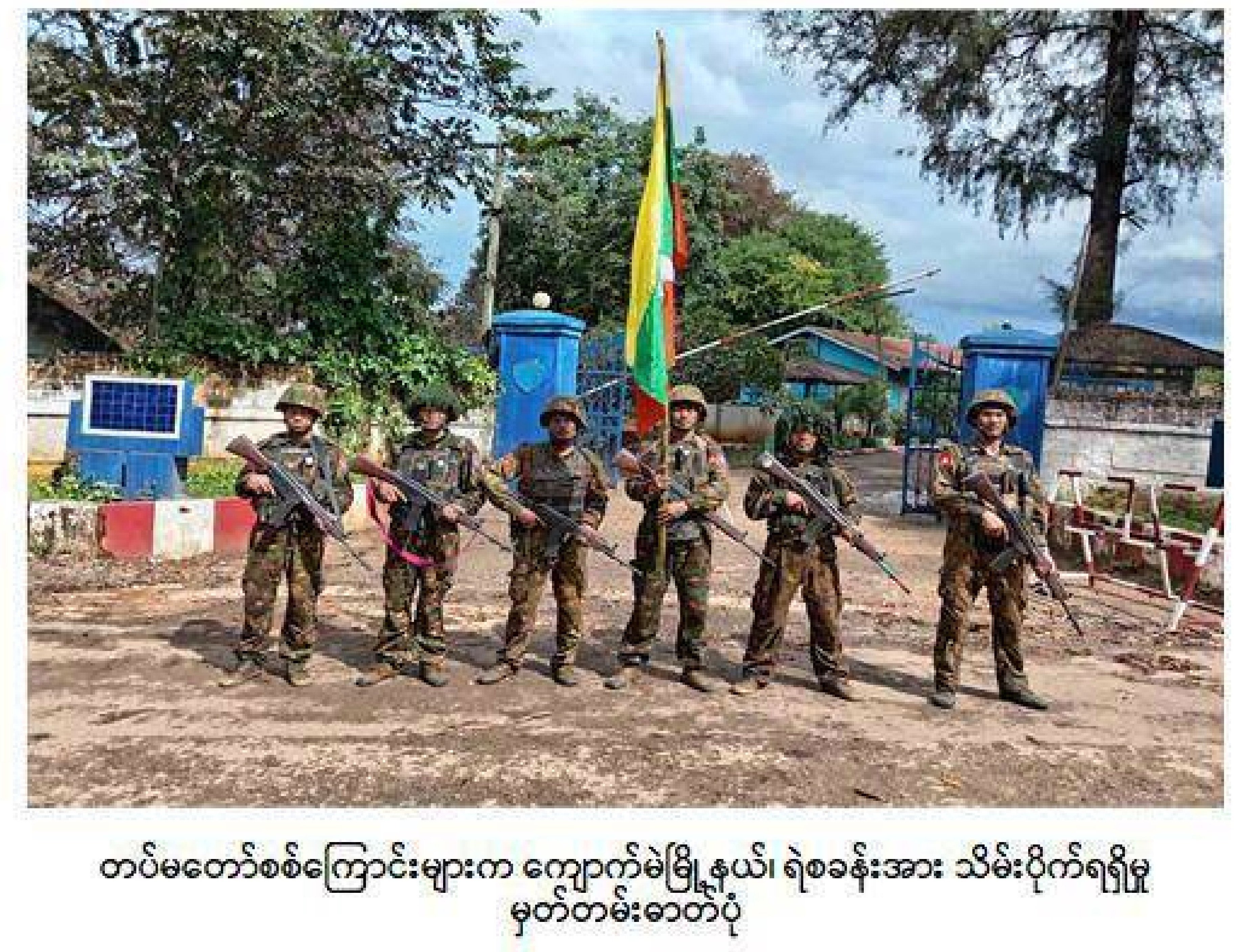 Myanmar’s soldiers stand in front of a captured police station in Kyaukme, a town in Shan state that the resistance forces had controlled for more than a year. Photo: AP