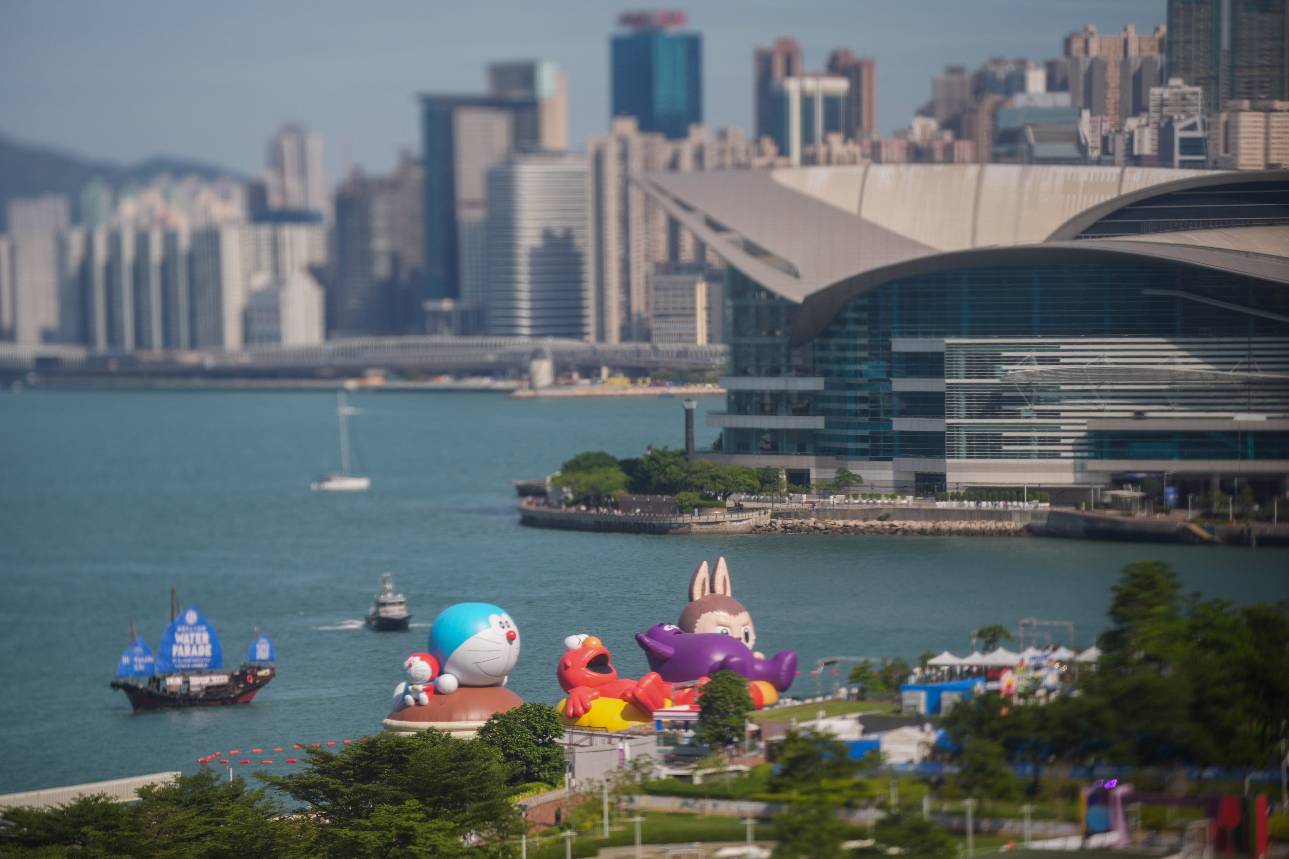 Giant inflatables of Labubu, the Japanese manga character Doraemon, Elmo from Sesame Street and Grimace from McDonald’s float in the Victoria Harbour off Admiralty. Photo: Eugene Lee