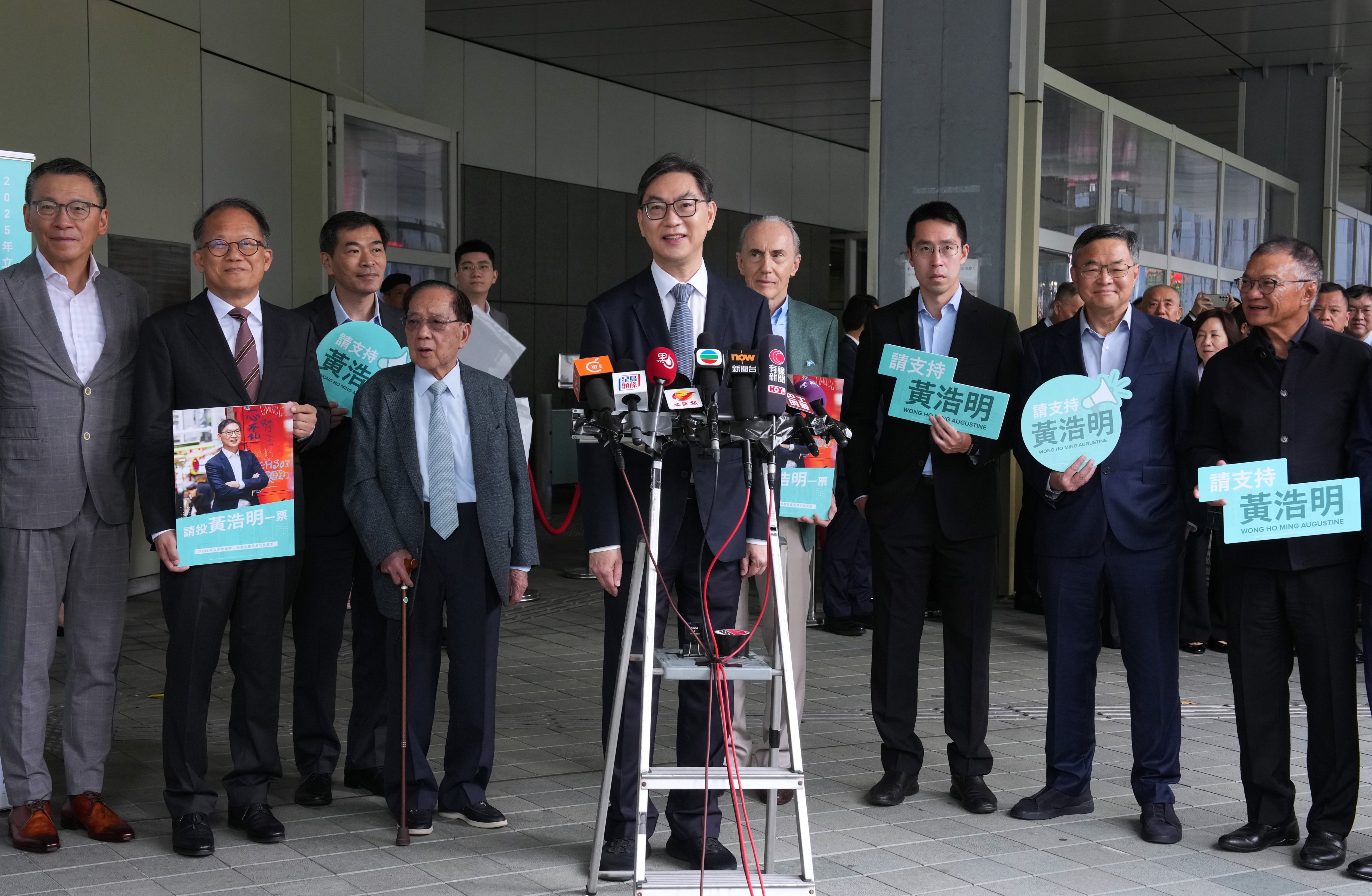 Augustine Wong (centre) announces his intention to run in the coming Legco election. Photo: Jelly Tse
