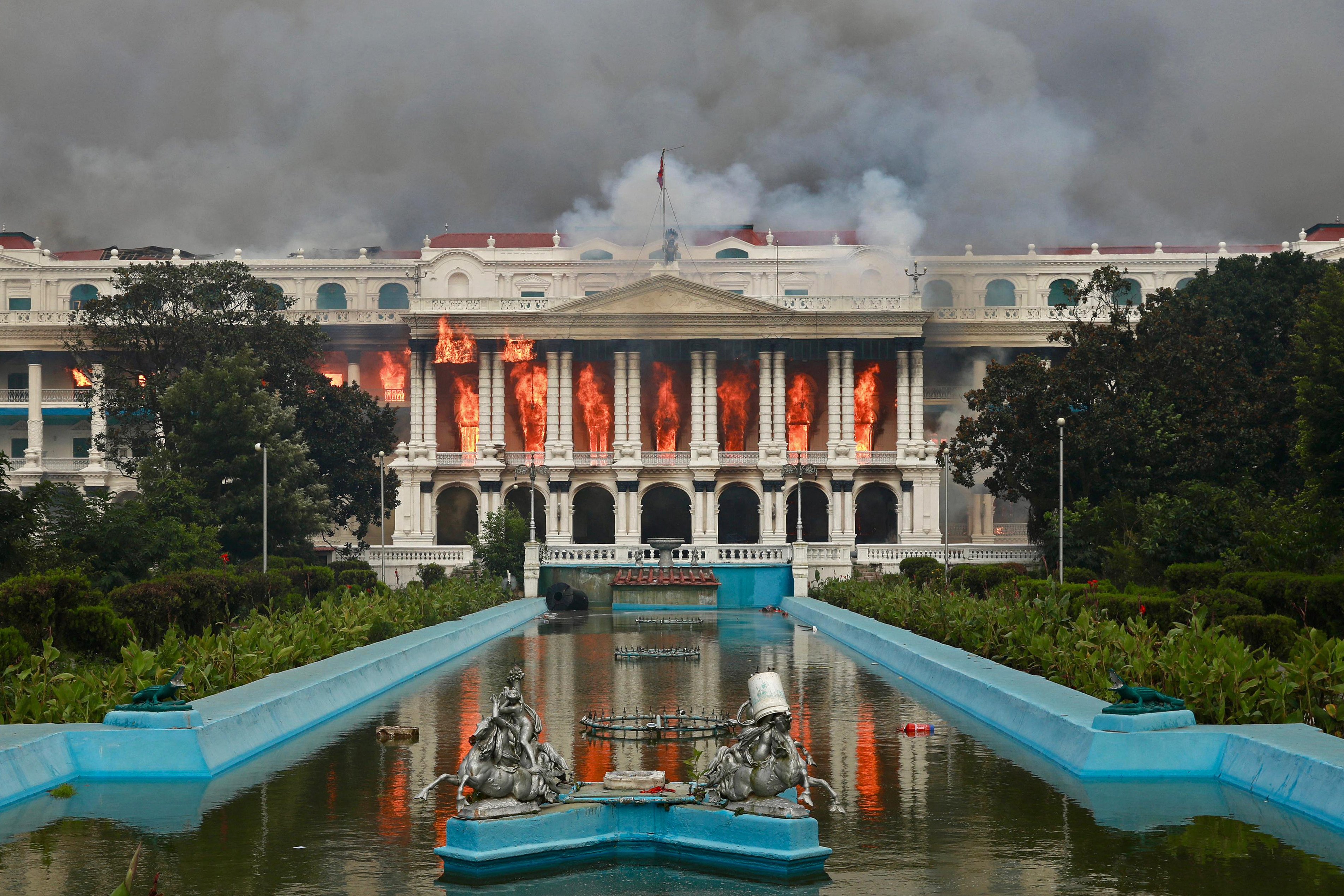 Fires rage in the Singha Durbar, the Nepalese government’s main administrative building, in Kathmandu on September 9. Photo: AFP