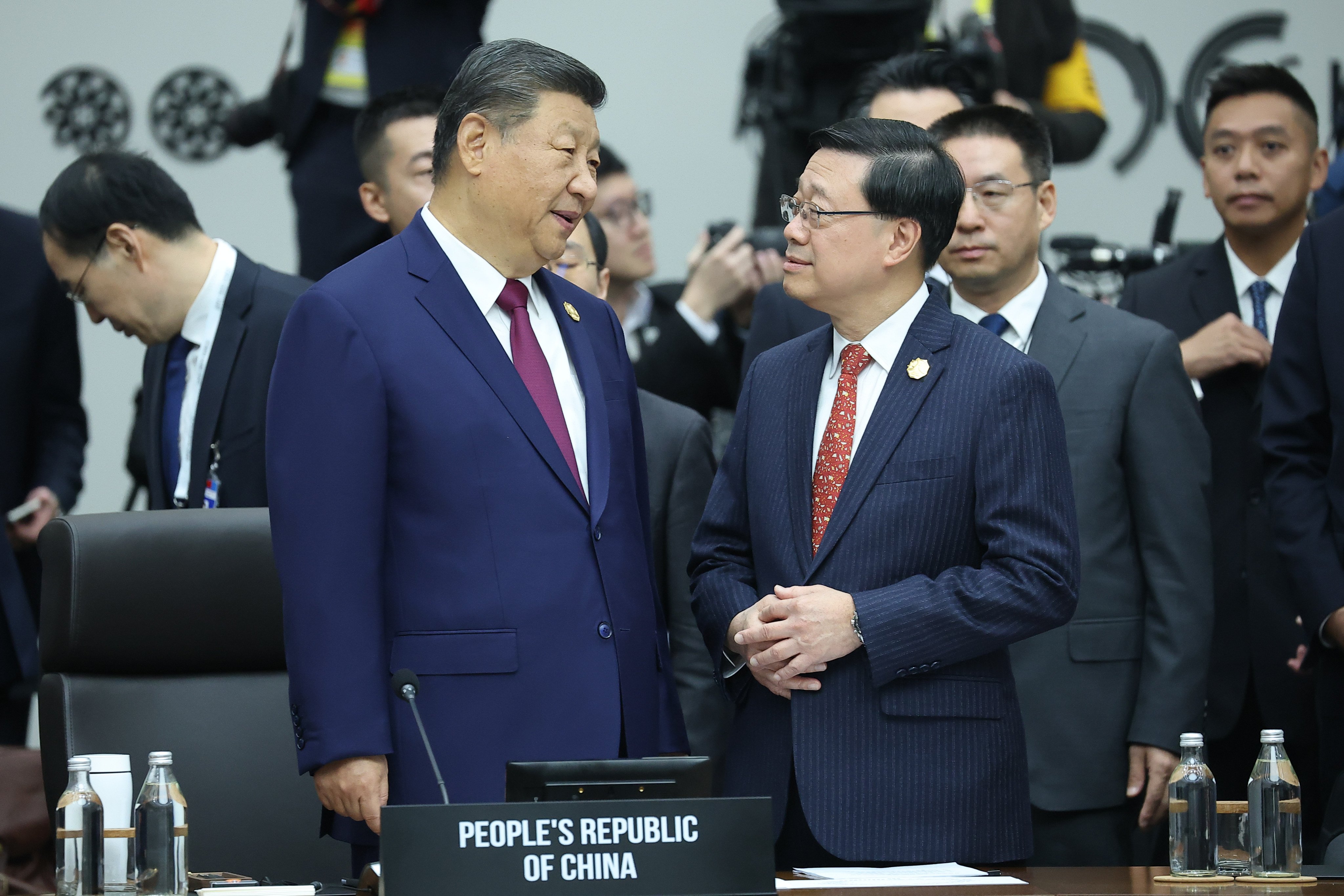 President Xi Jinping (left) chats with Chief Executive John Lee ahead of an Apec meeting on Friday. Photo: Yonhap via AP