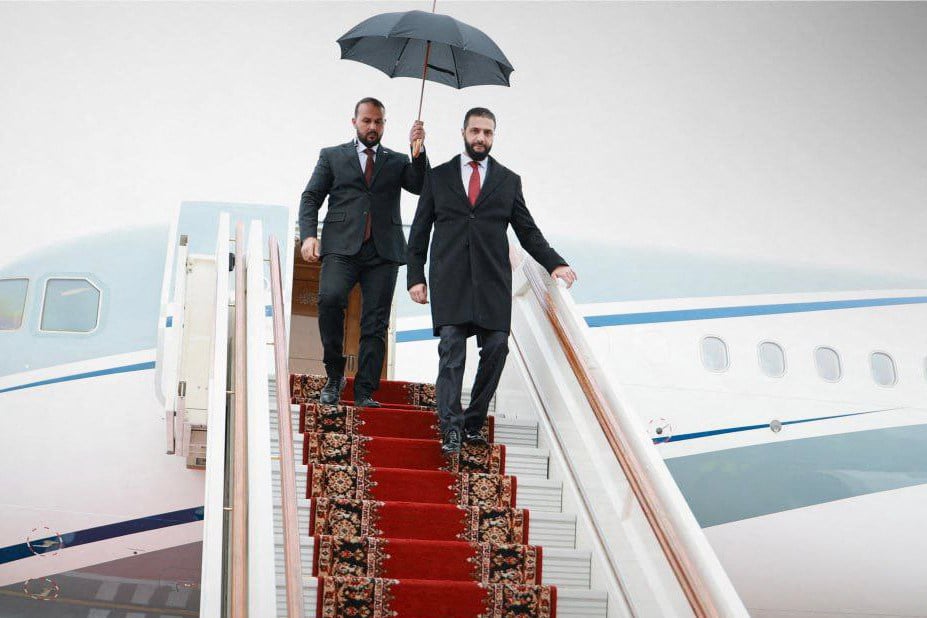 Syria’s interim President Ahmed al-Sharaa (right) disembarks from a plane during a state visit to Russia on October 15. He is expected to visit Beijing this month. Photo: Syrian Arab News Agency/AFP