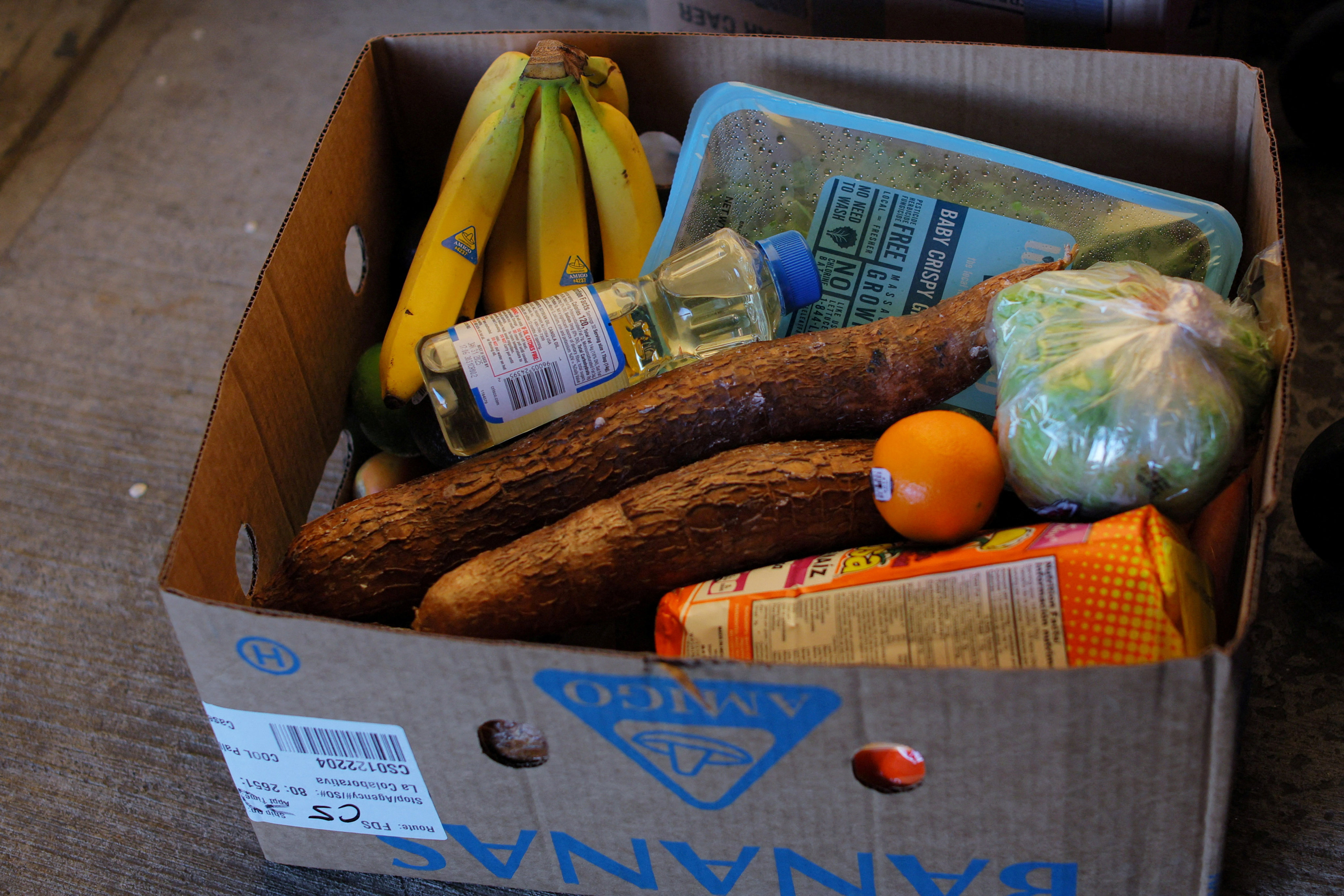 Food sits in a box of free groceries for residents at a food pantry run in Massachusetts. Photo: Reuters