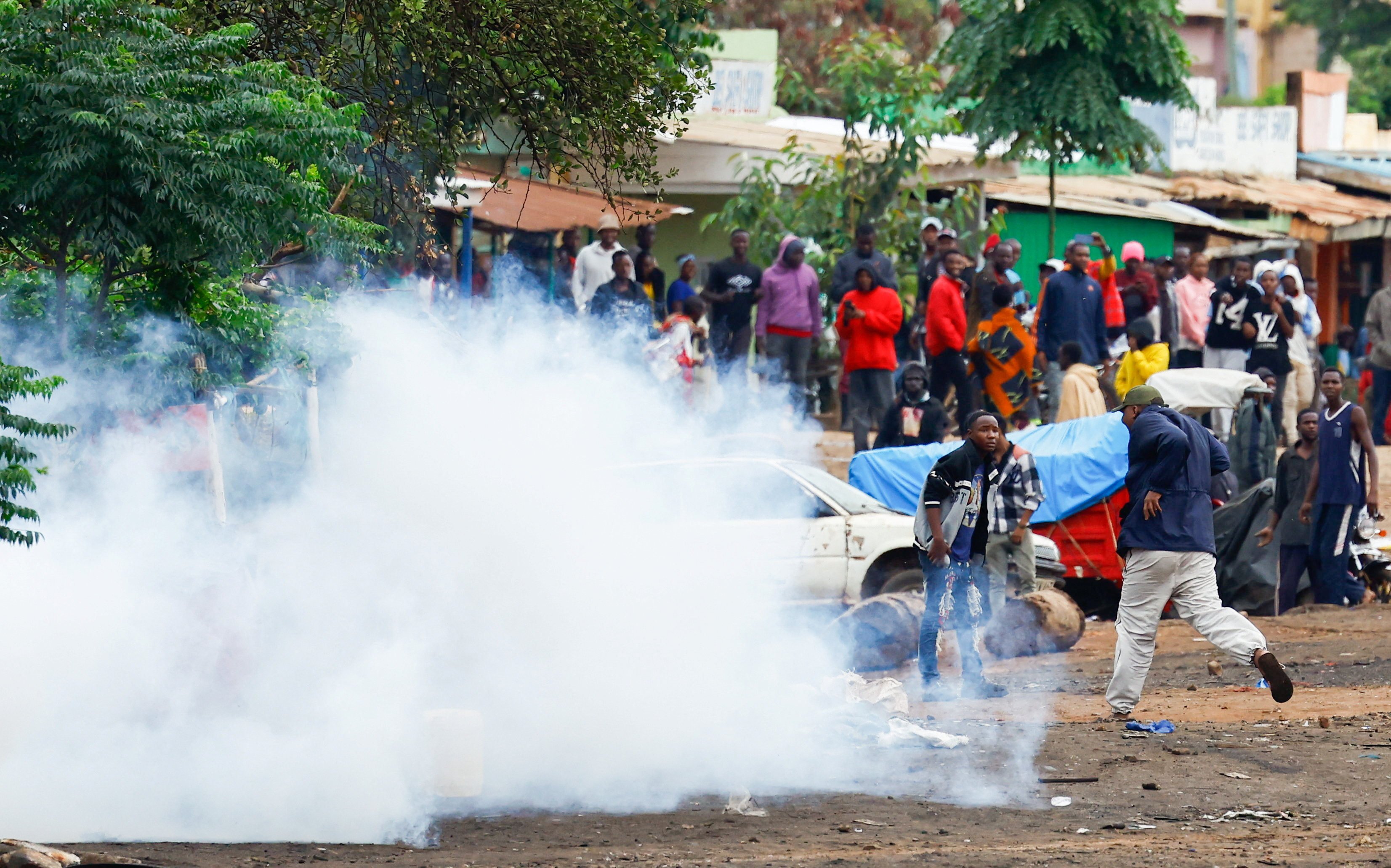 Tanzanian riot police officers use tear gas to disperse demonstrators at the Namanga One-Post Border crossing point between Kenya and Tanzania on Thursday. Photo: Reuters