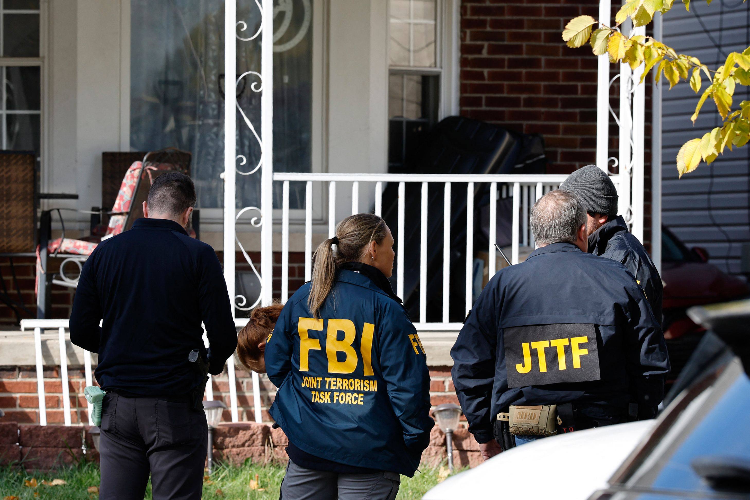 Members of the FBI Joint Terrorism Task Force take part in a search on a home in Dearborn, Michigan, on Friday. Photo: AFP