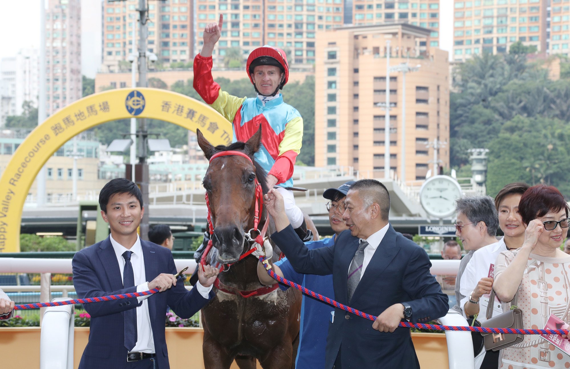 Jockey Zac Purton and connections celebrate Hakka Radiance's latest success.