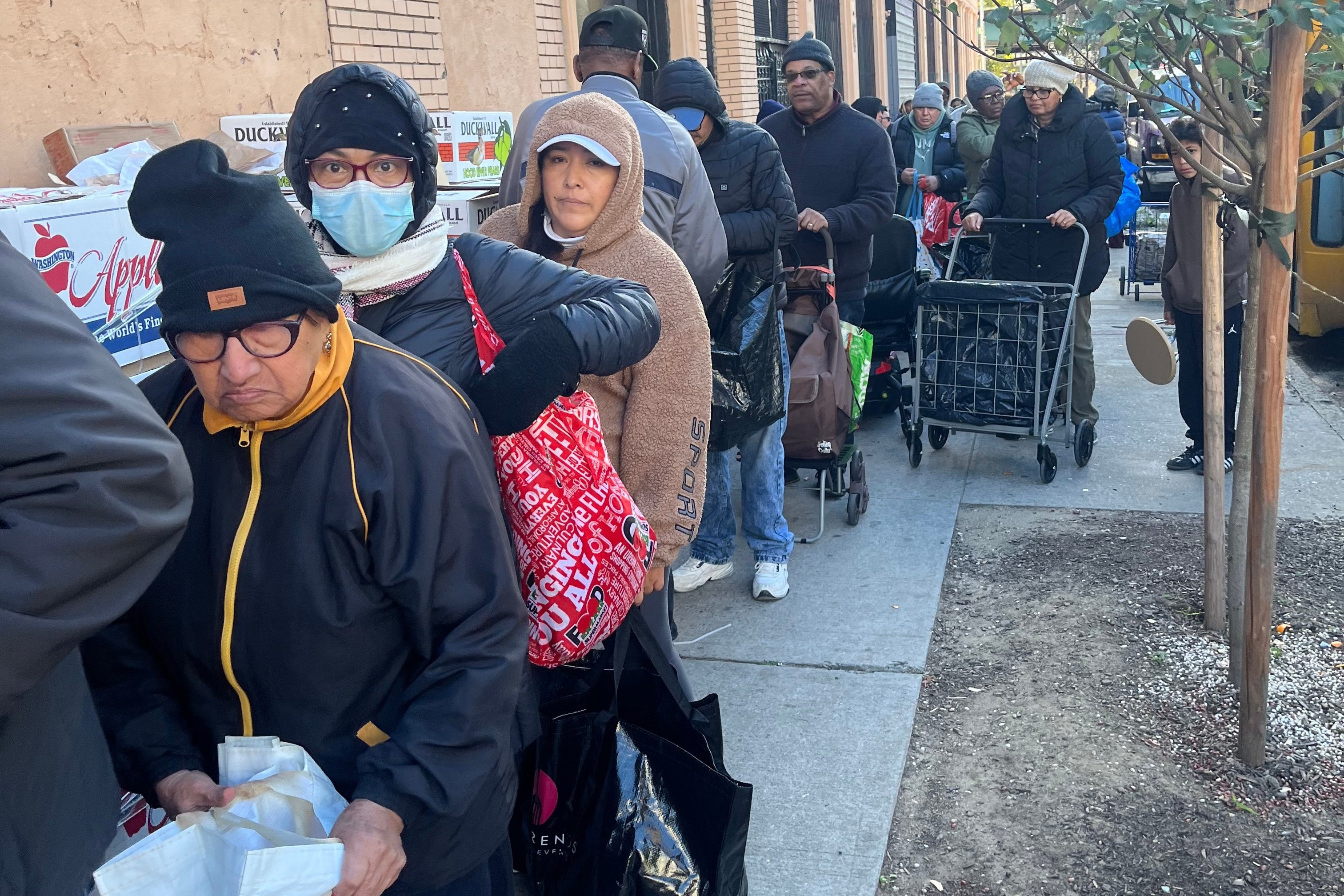 People wait in line for free food at the World of Life Christian Fellowship International food pantry in New York on Saturday. Photo: Reverend John Udo-Okon via AP
