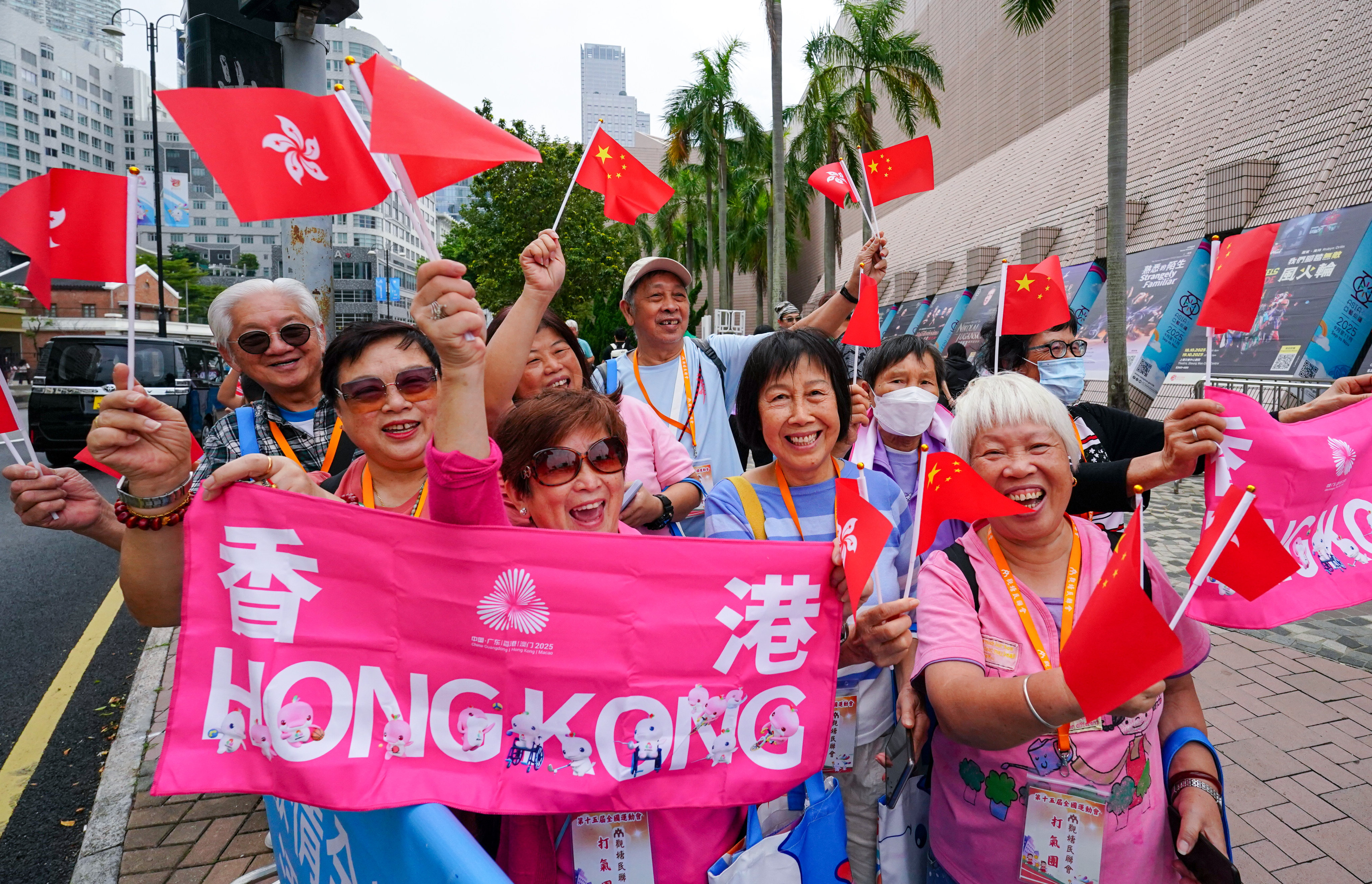 Excited spectators in Tsim Sha Tsui show their support for torch-bearers in Sunday’s relay. Photo: Felix Wong