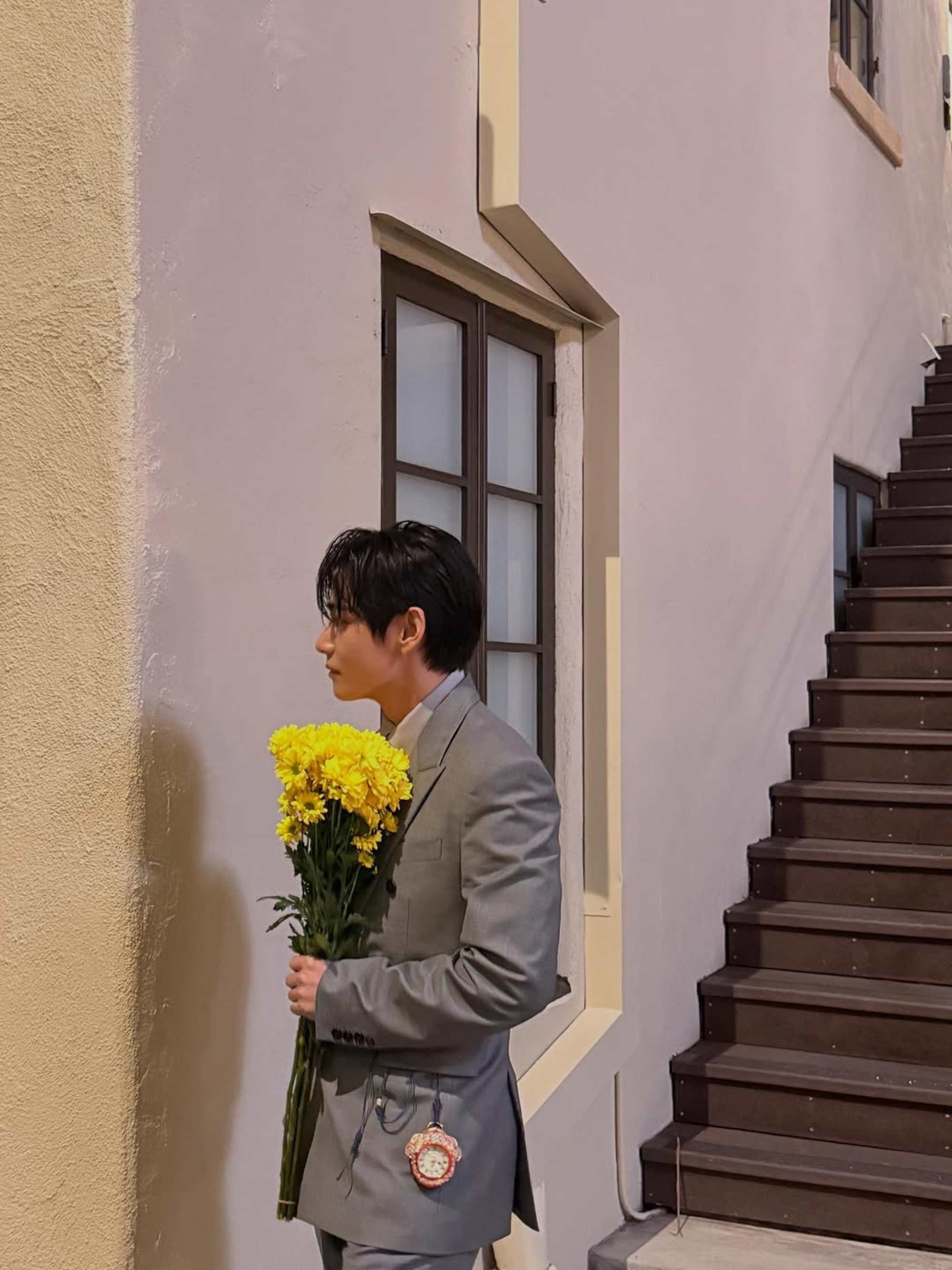 V from BTS sports a Roger Lascelles pocket watch suspended by a cord at Vogue World. Photo: Handout