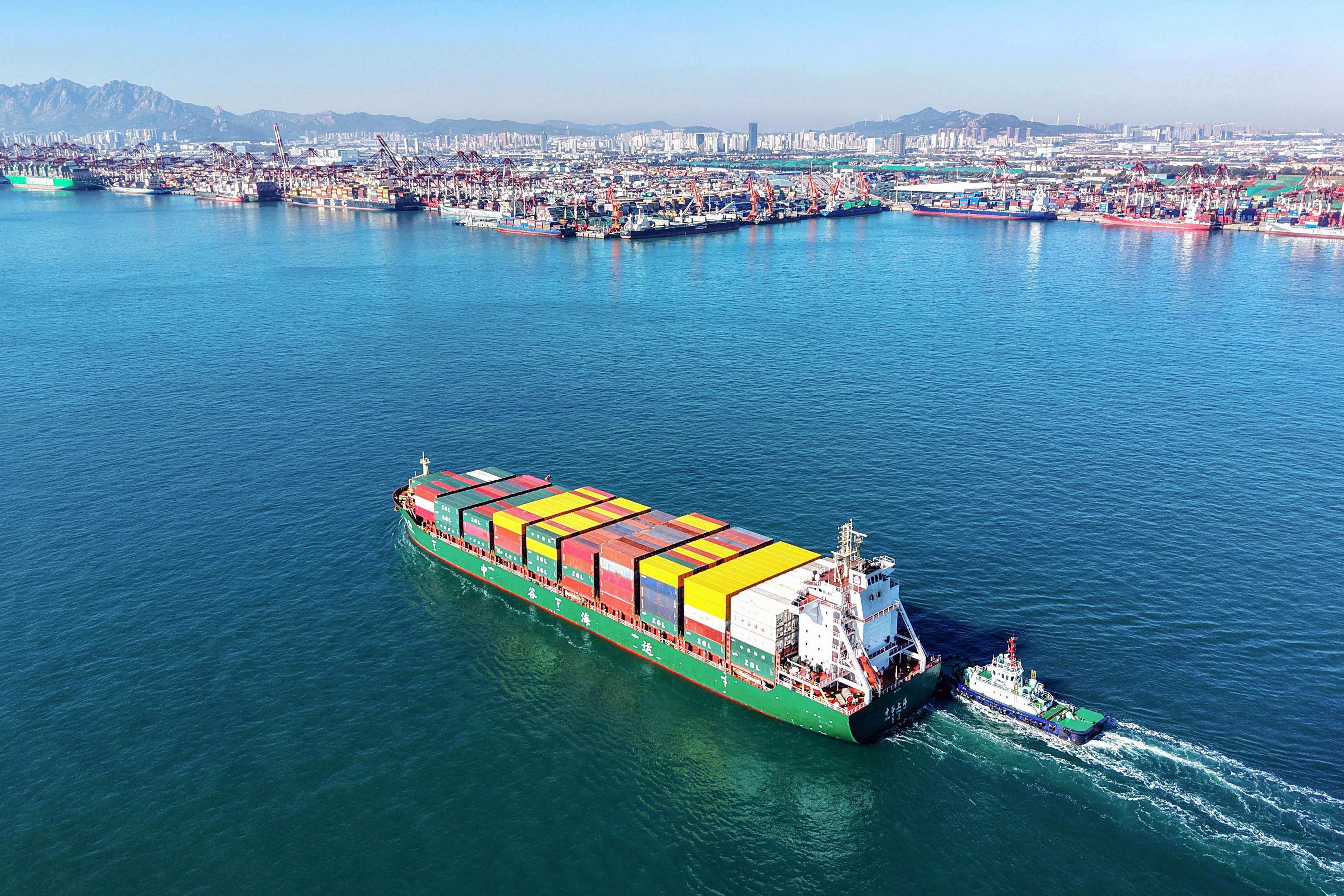 A cargo ship sails into the port in Qingdao in China’s Shandong province on Monday. Photo: AFP