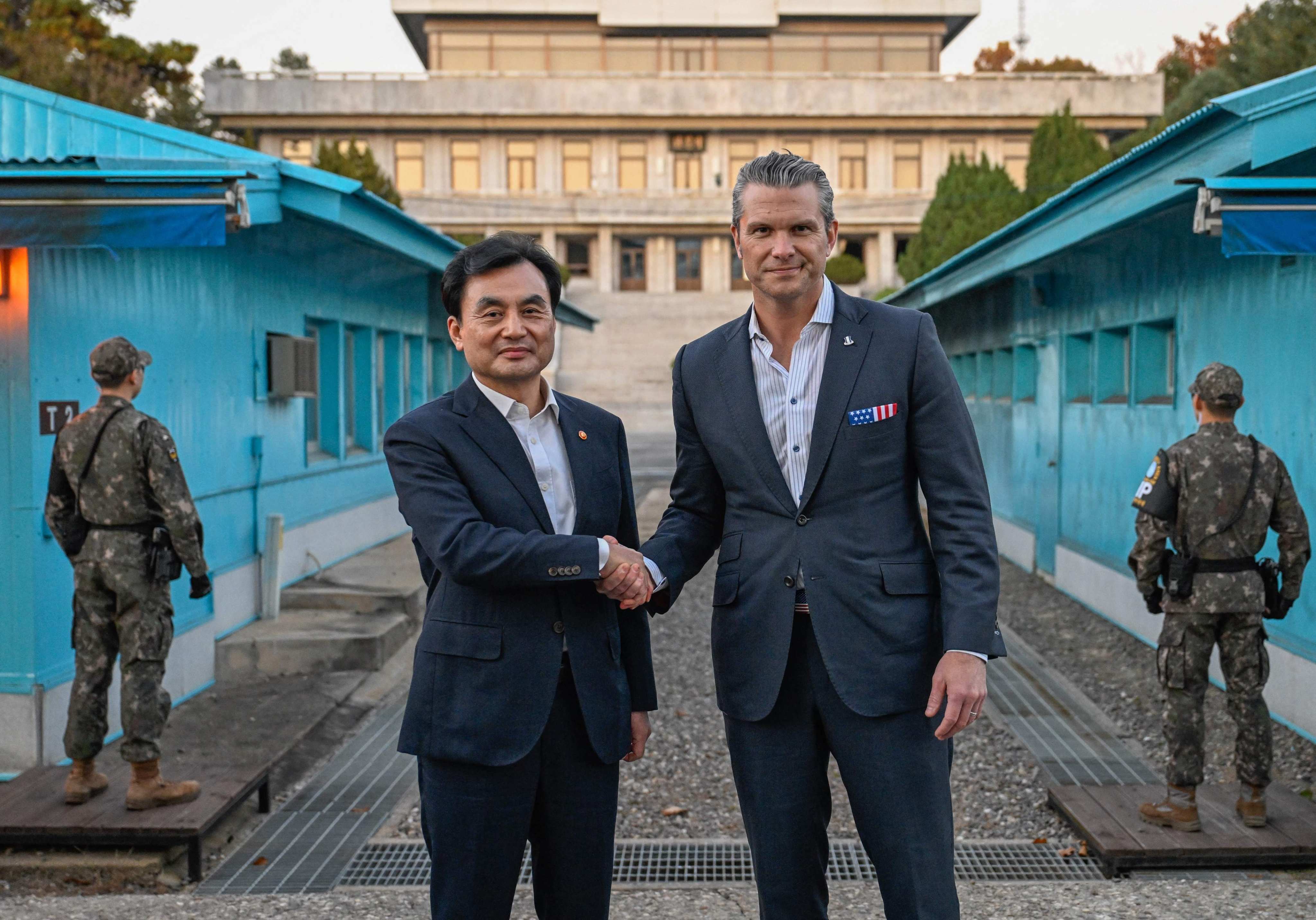 US Defence Secretary Pete Hegseth (right) shaking hands with South Korean Defence Minister Ahn Gyu-back as they visit the truce village of Panmunjom in the demilitarized zone dividing the two Koreas on Monday. Photo: AFP/South Korean Defence Ministry